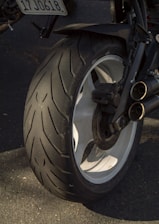 A close up of a motorcycle tire on a street
