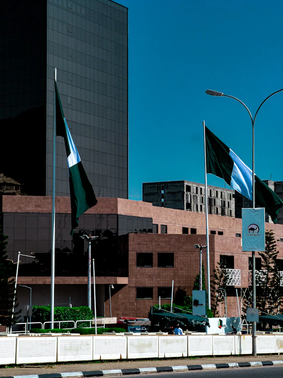 A city street with a lot of flags on the side of it