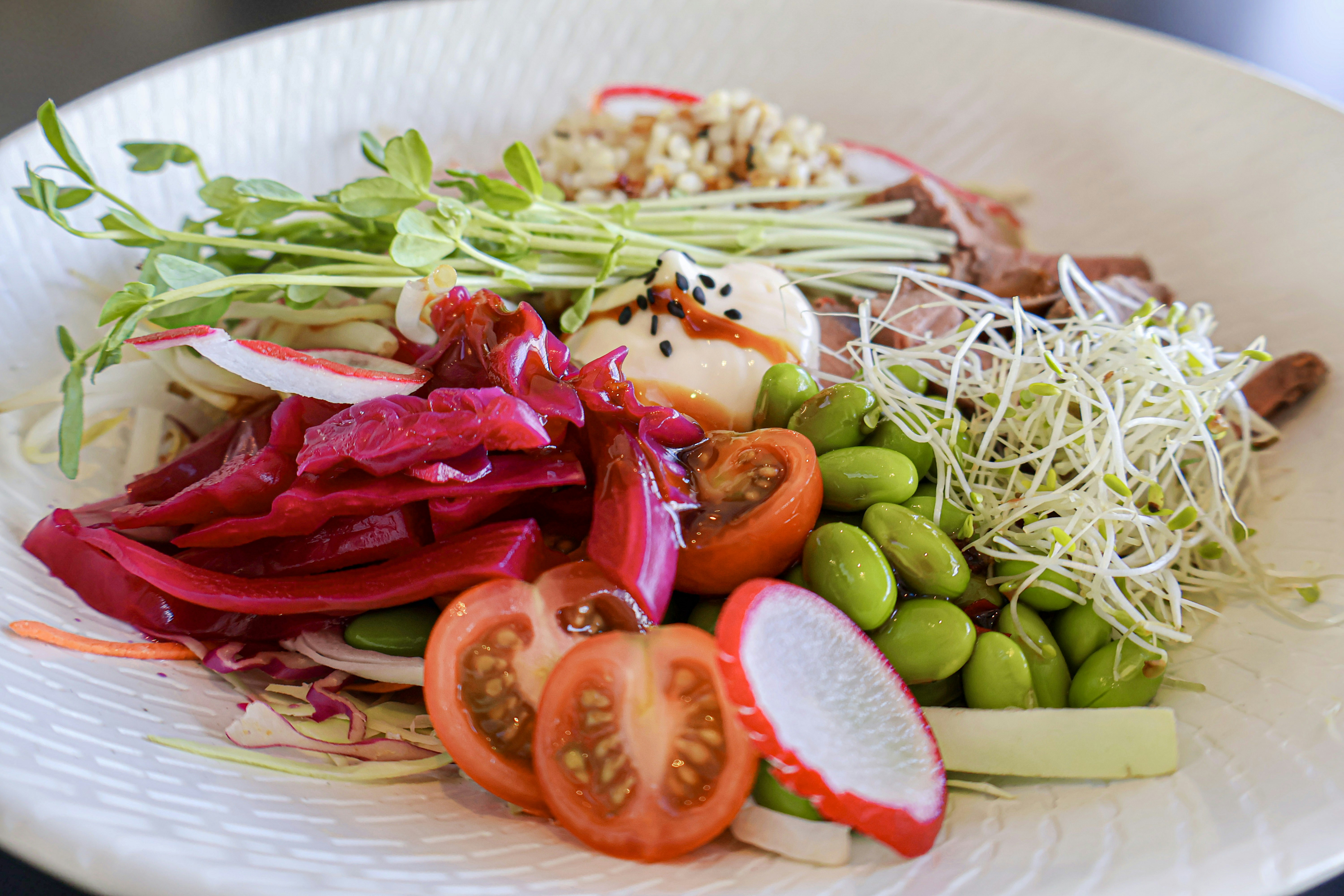 A white plate topped with lots of veggies