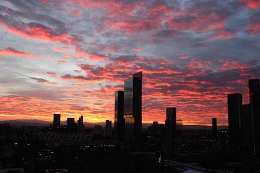 A view of a city skyline at sunset