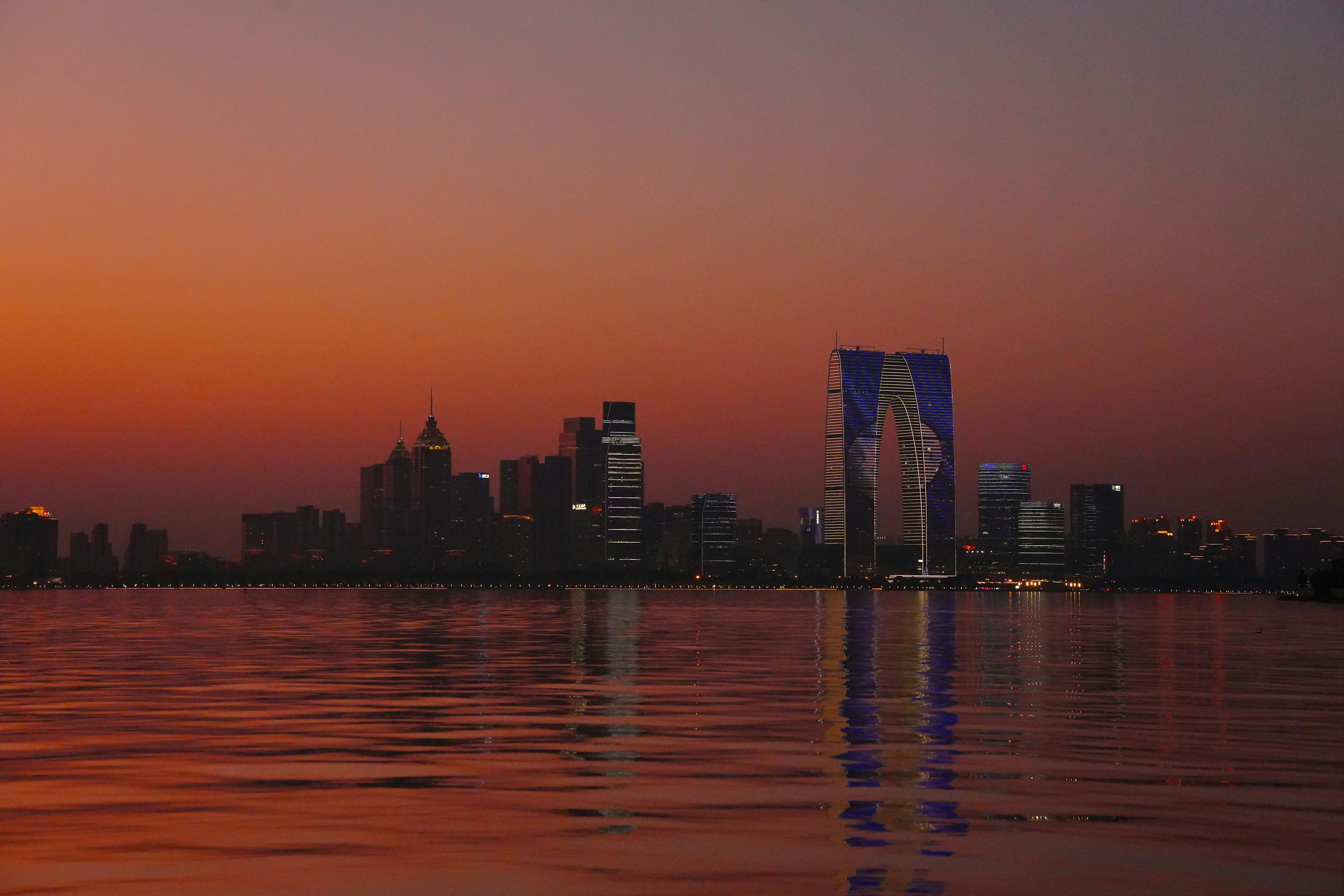 Cleveland skyline at sunset reflecting in Lake Erie, representing local business and digital change - Cleveland website redesign