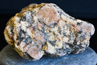 A rock that is sitting on top of a rock