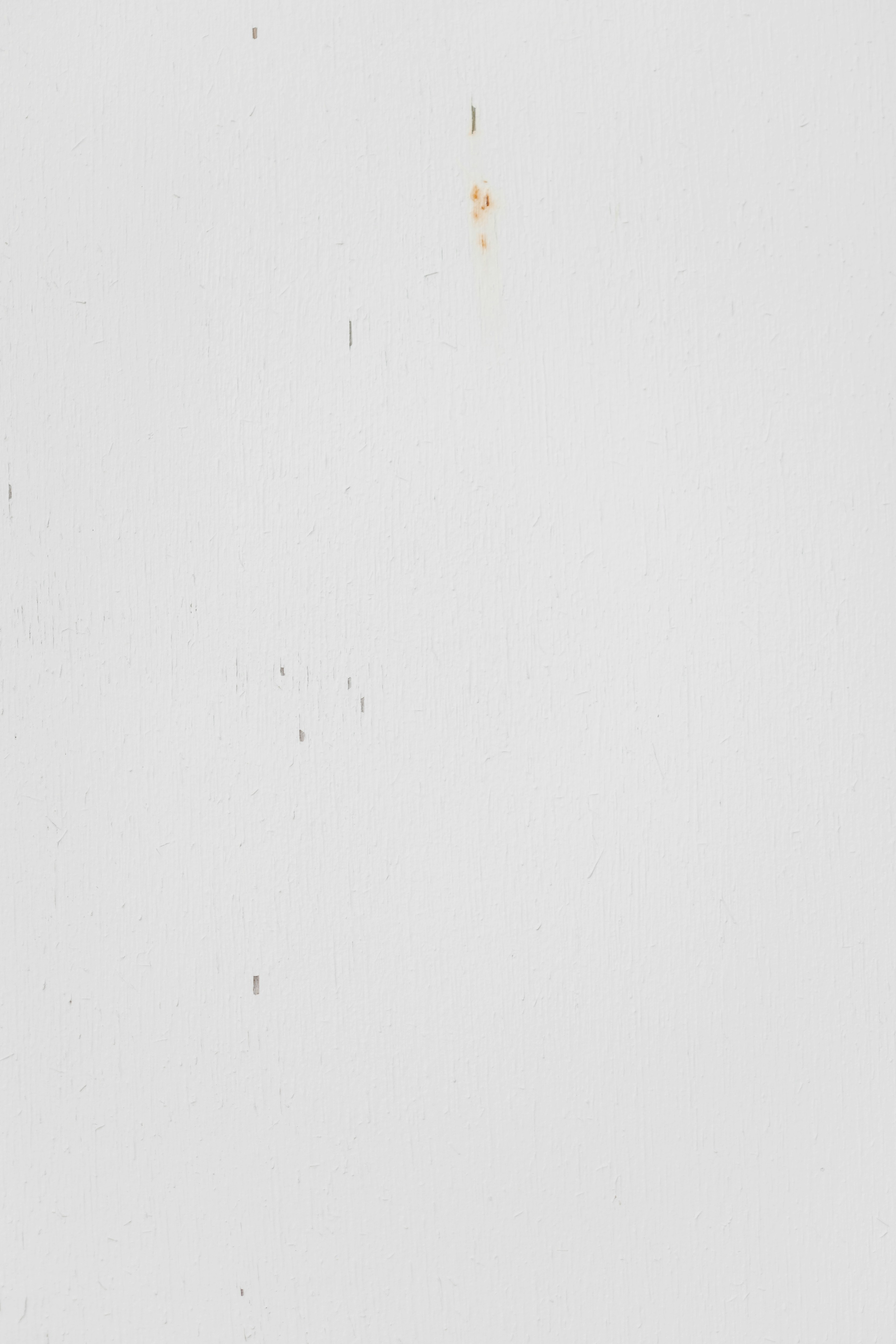 A black and white photo of a clock on a wall