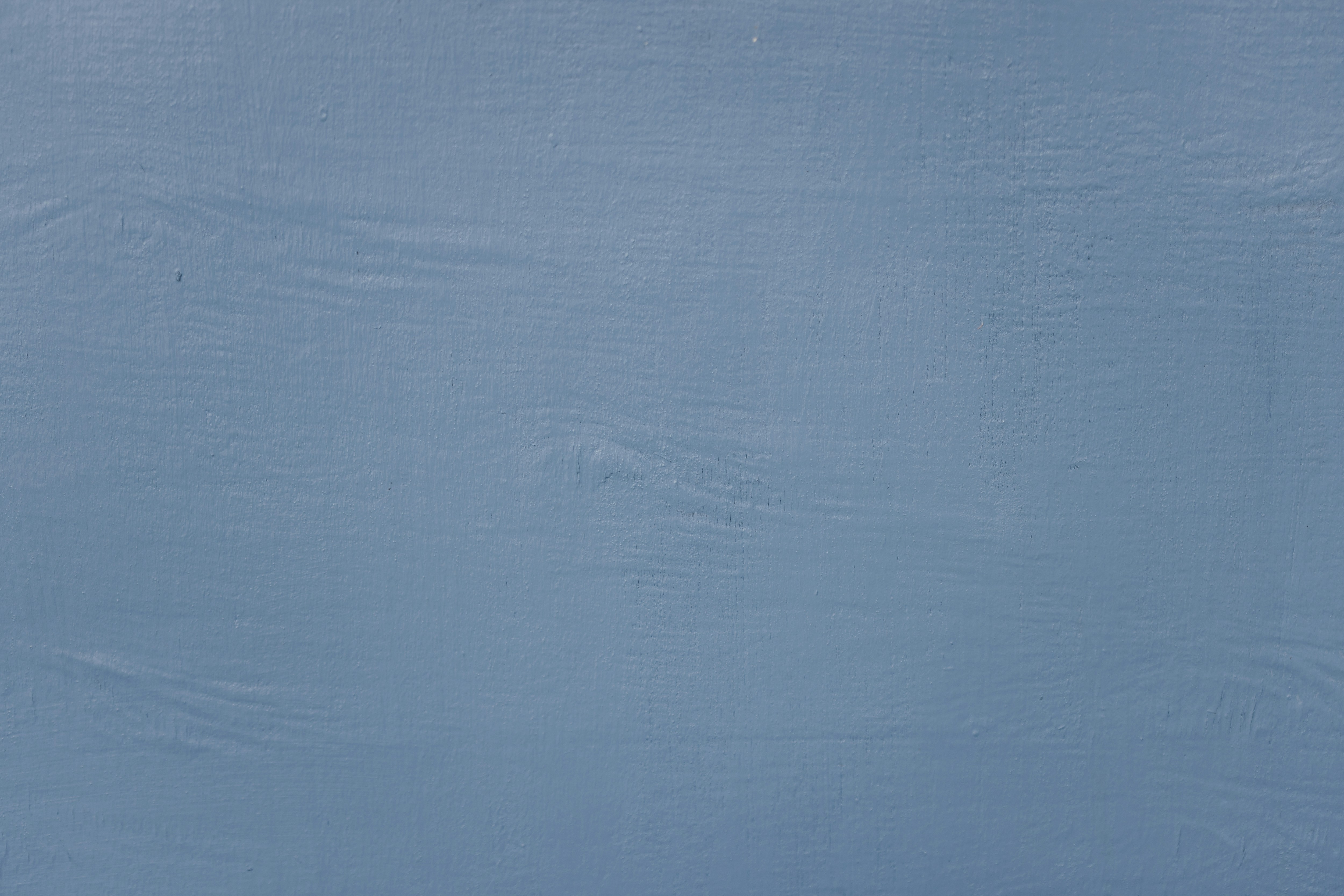 A man is skiing down a snow covered slope