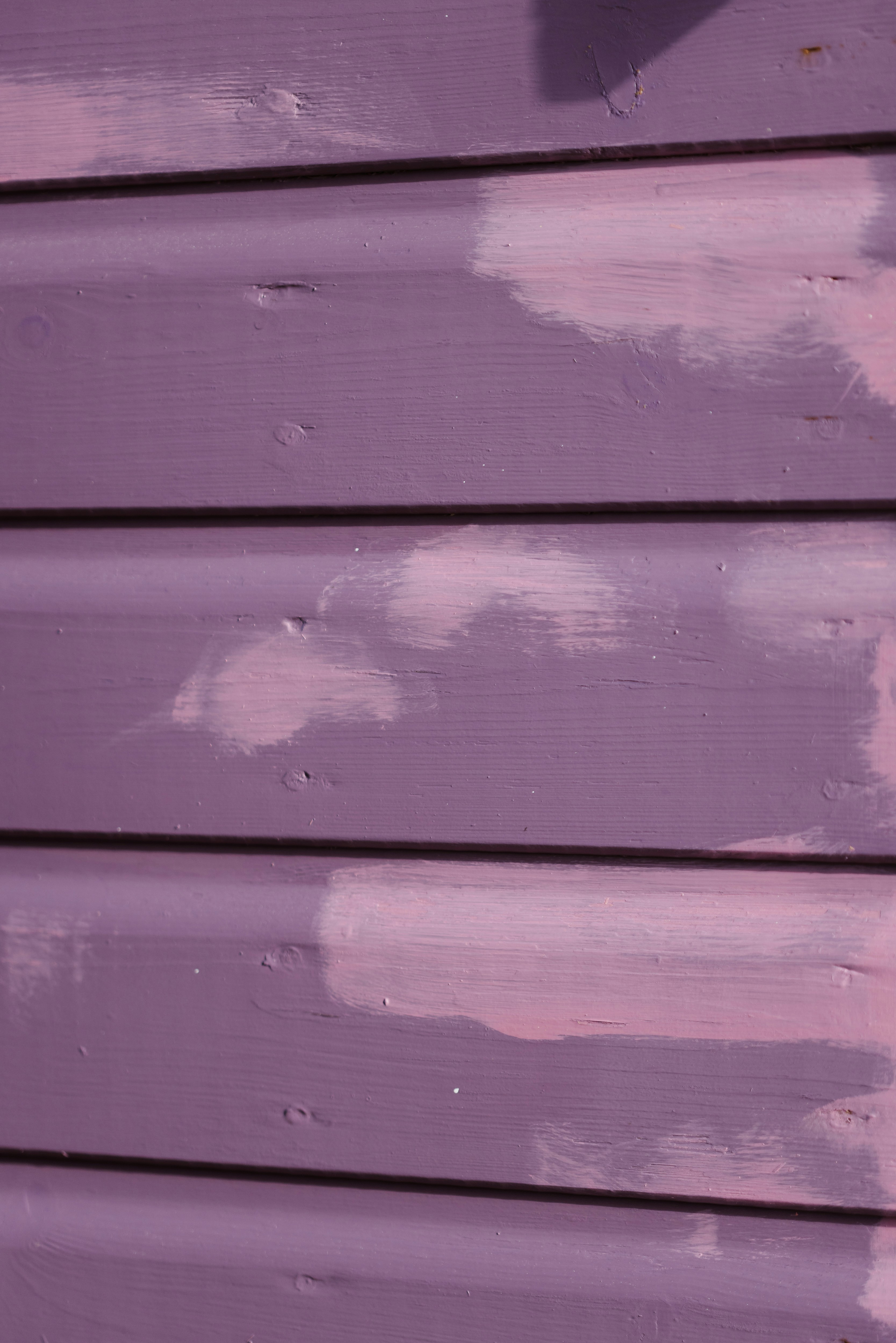 A close up of a purple painted wall