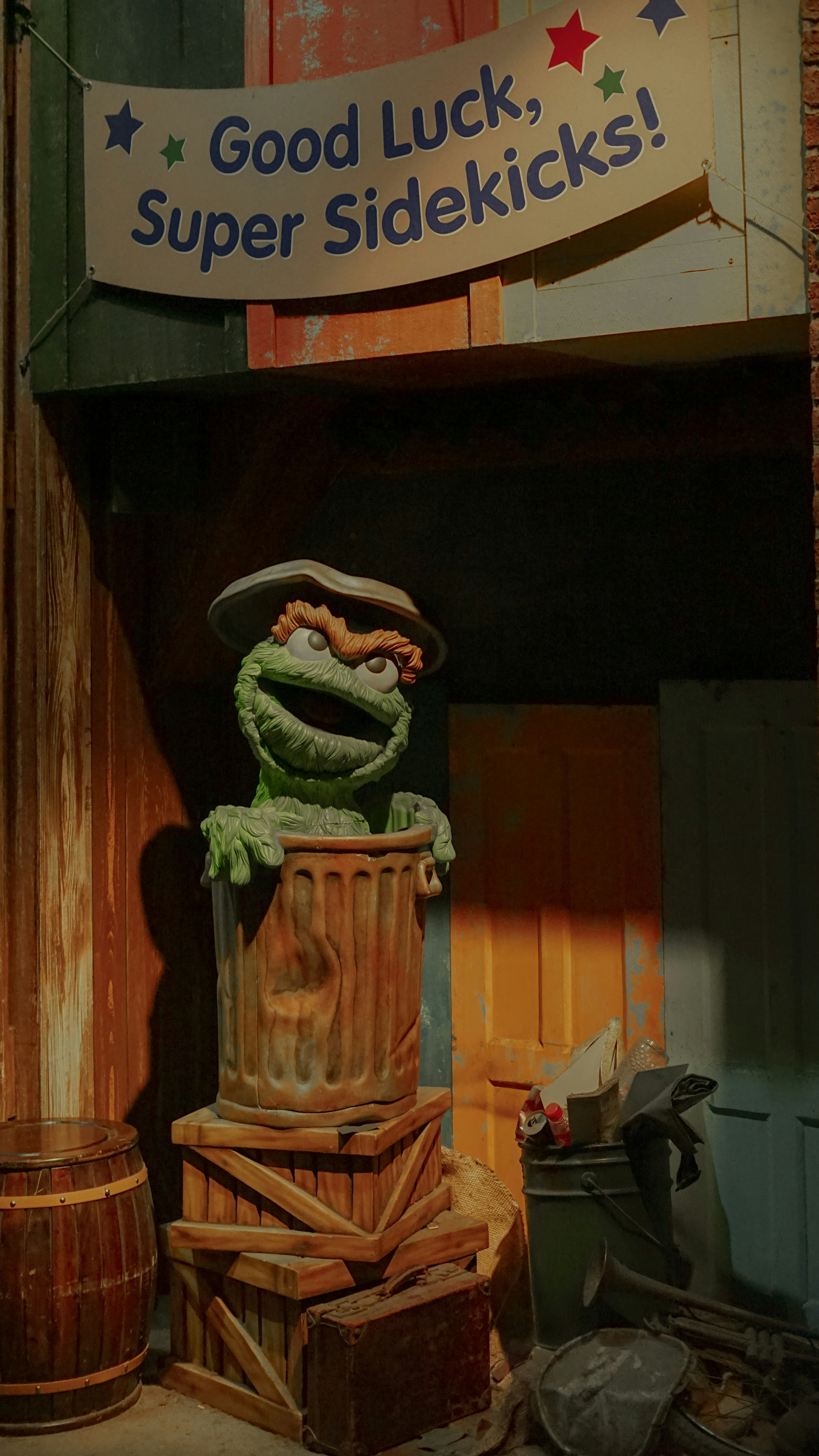 A statue of a frog with a hat on it's head