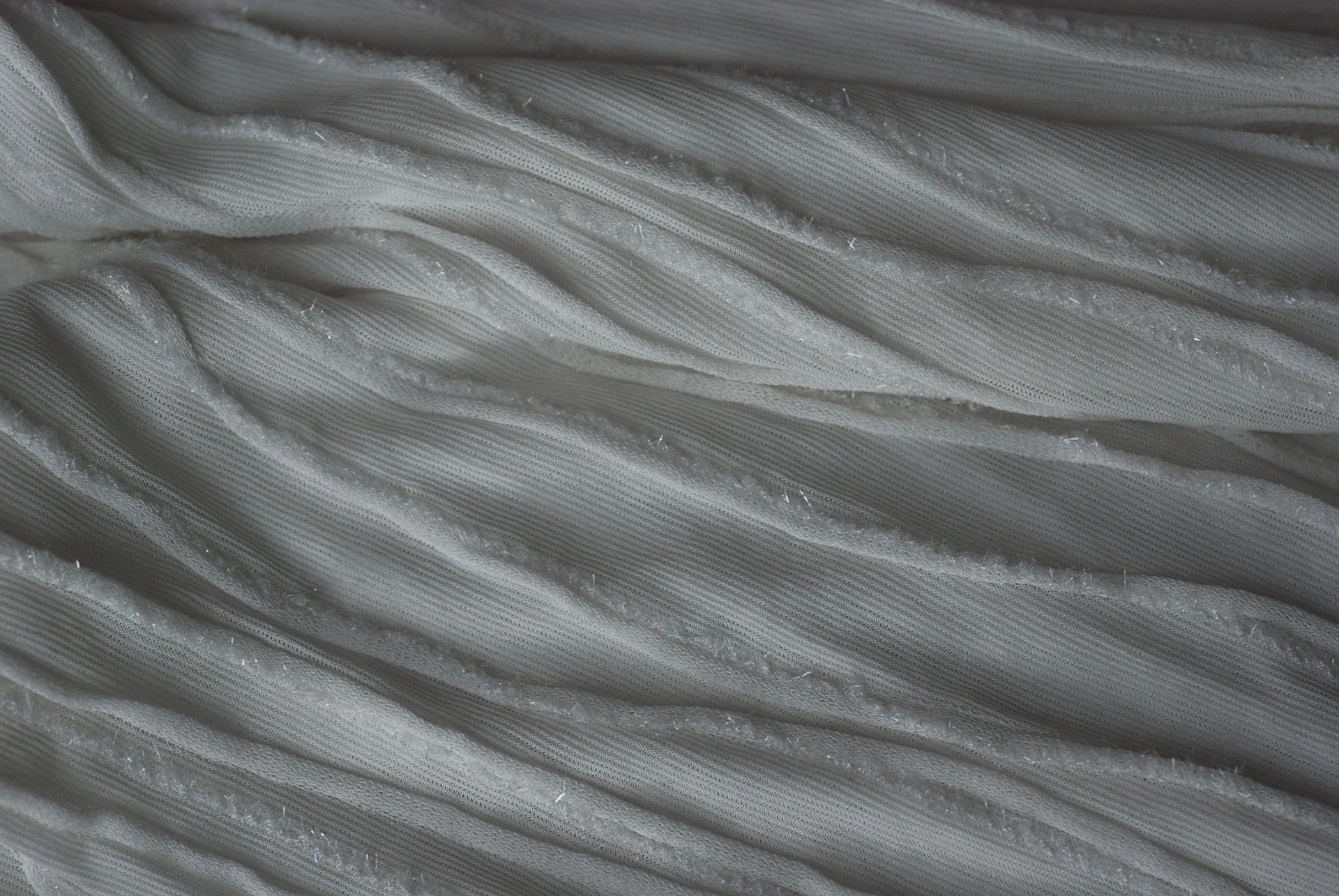 A close up view of a white blanket