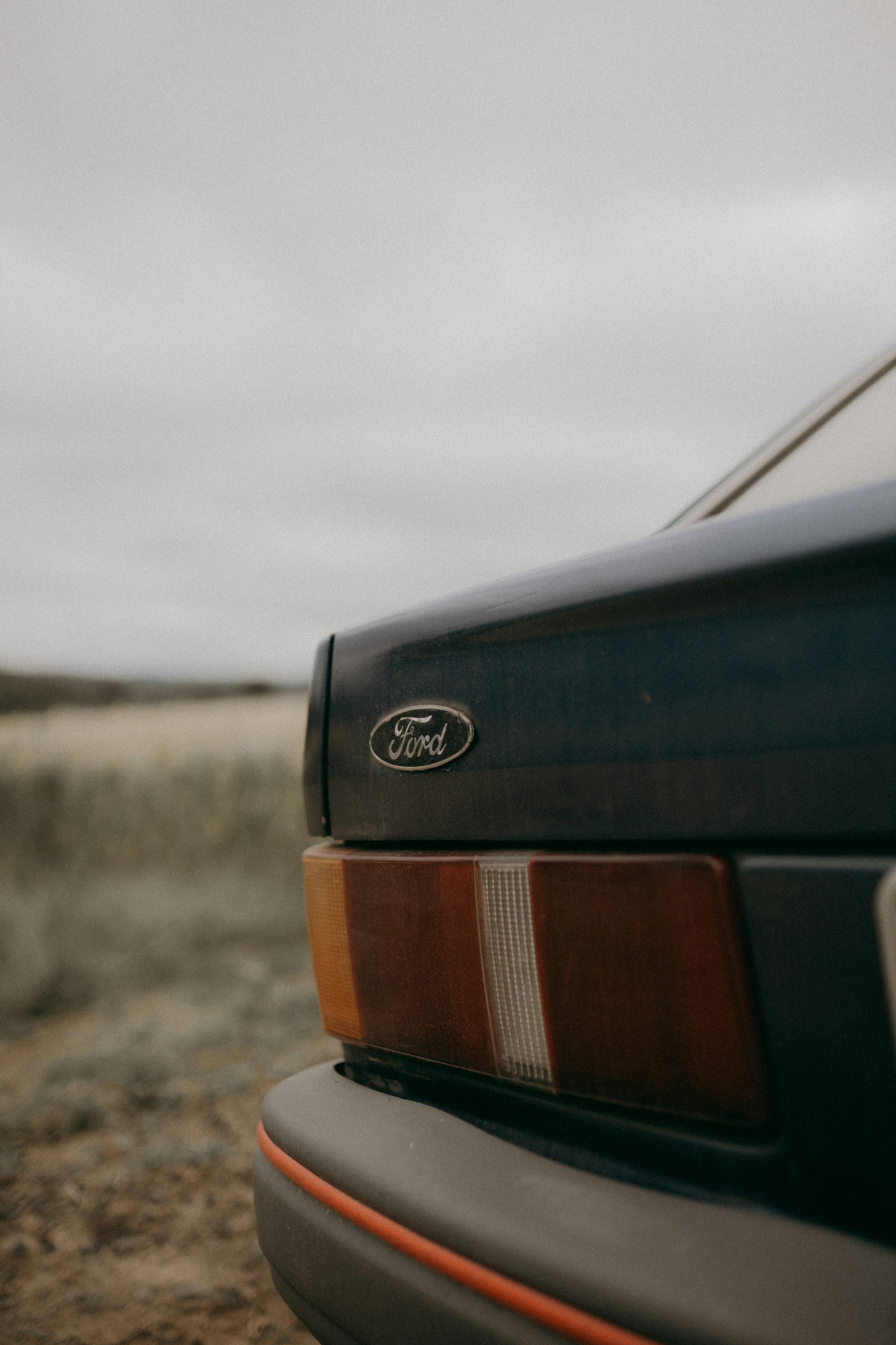A close up of a car parked on a dirt road photo – Free Car Image on ...