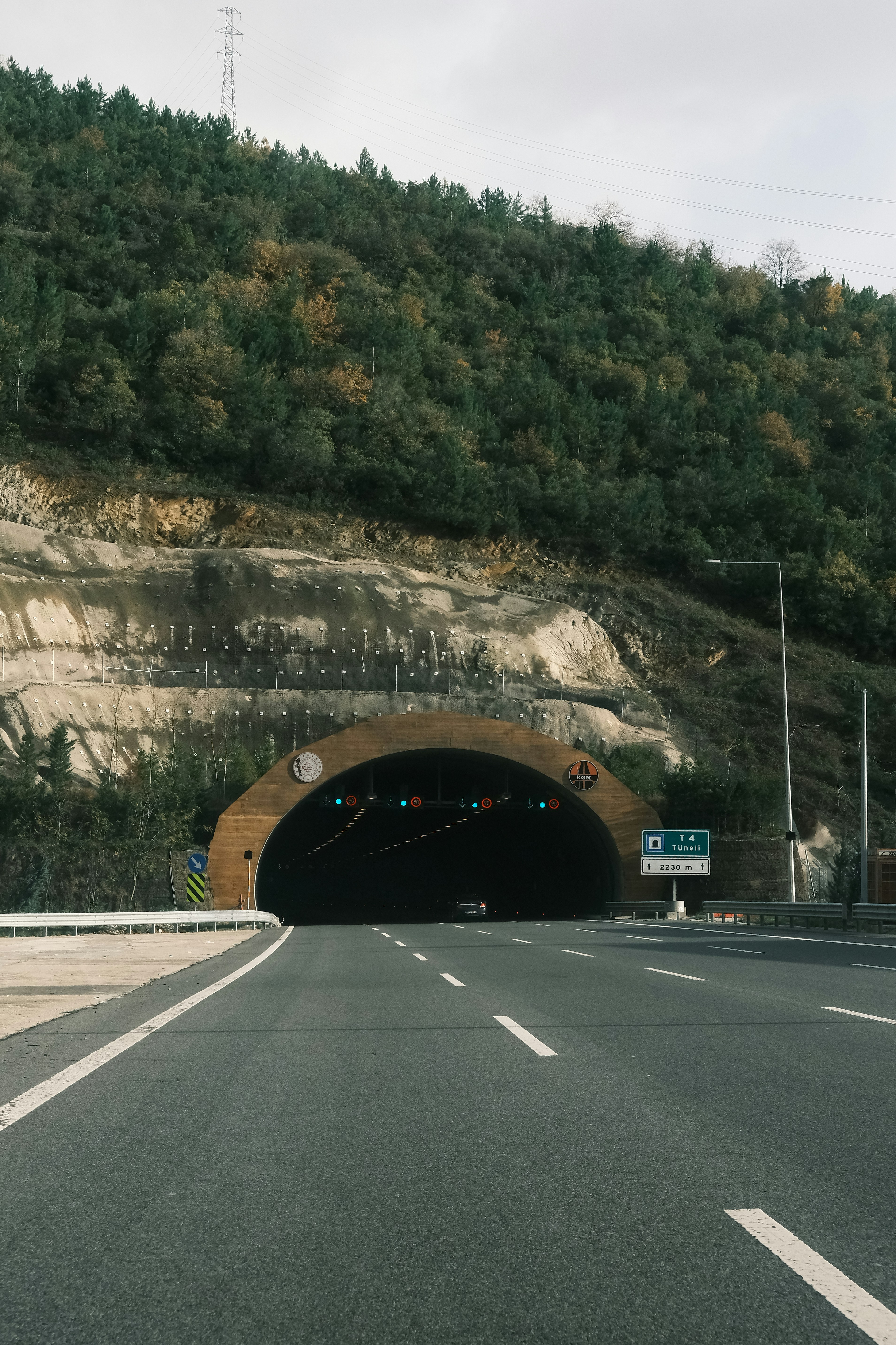 A car driving through a tunnel on a road