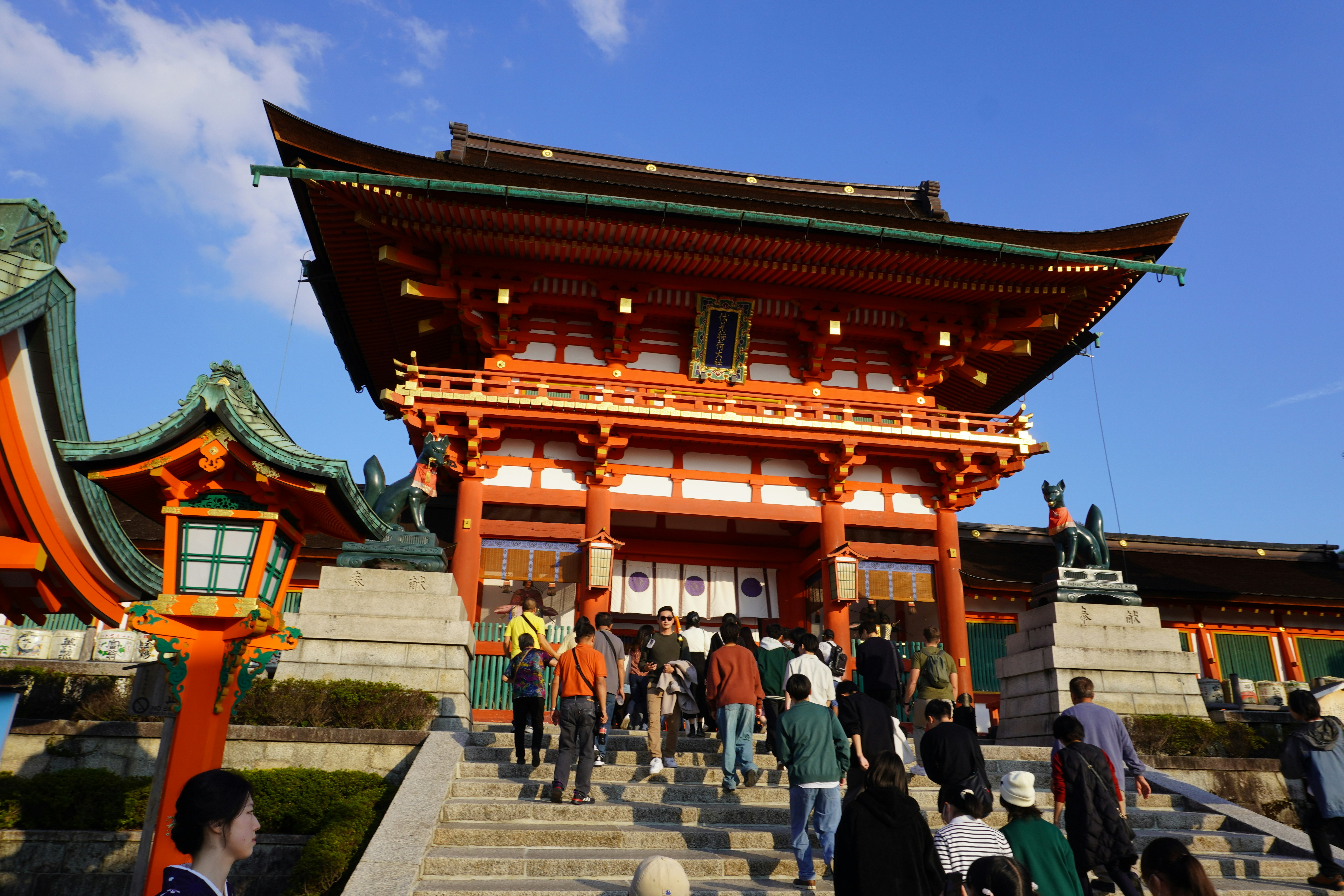 A group of people standing in front of a tall building