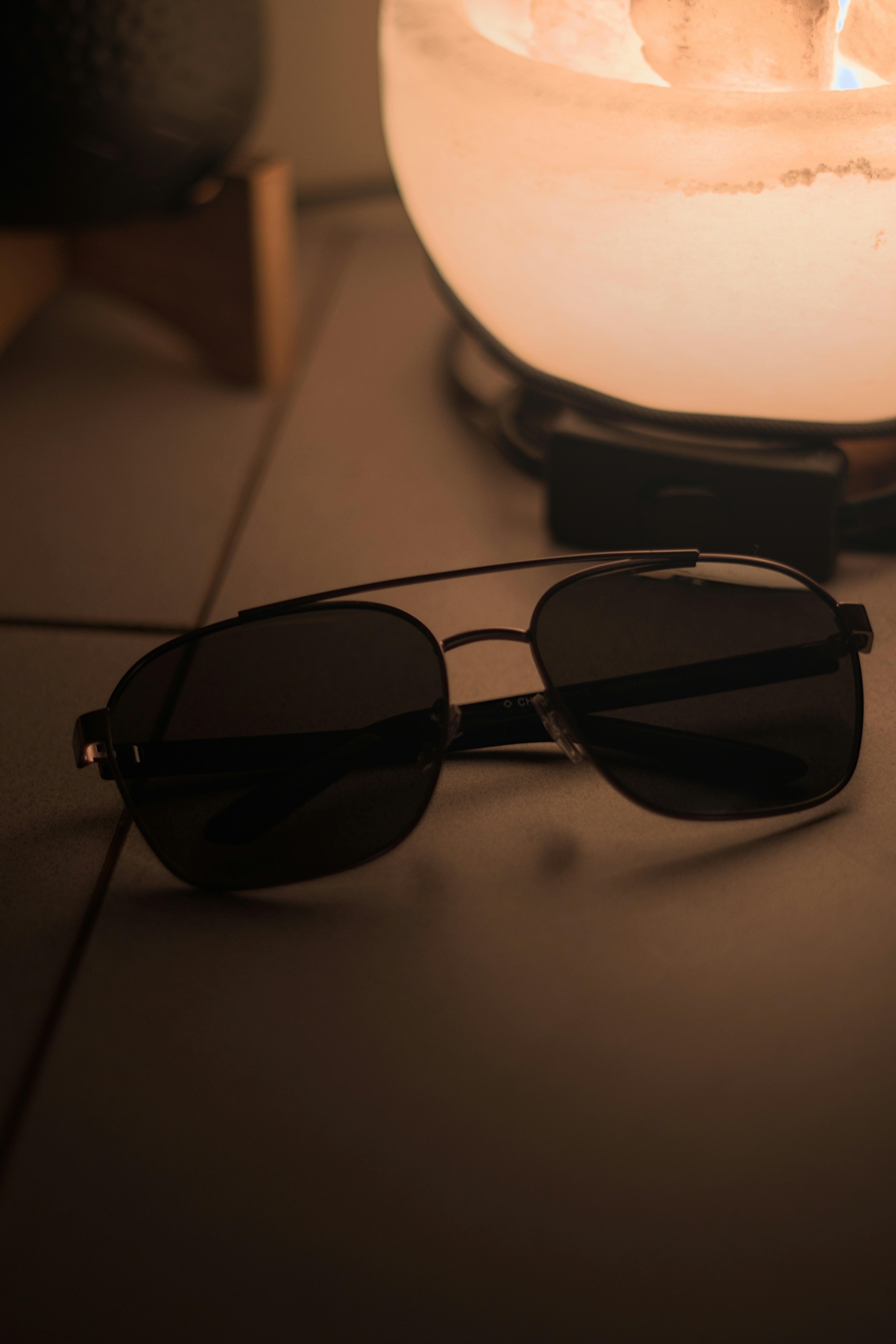 A pair of sunglasses sitting on top of a table
