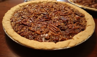 A pecan pie sitting on top of a wooden table