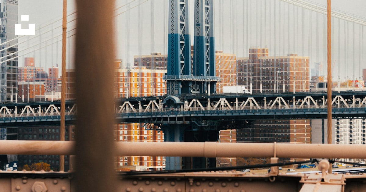 A view of a bridge over a body of water photo – Free Manhattan bridge ...