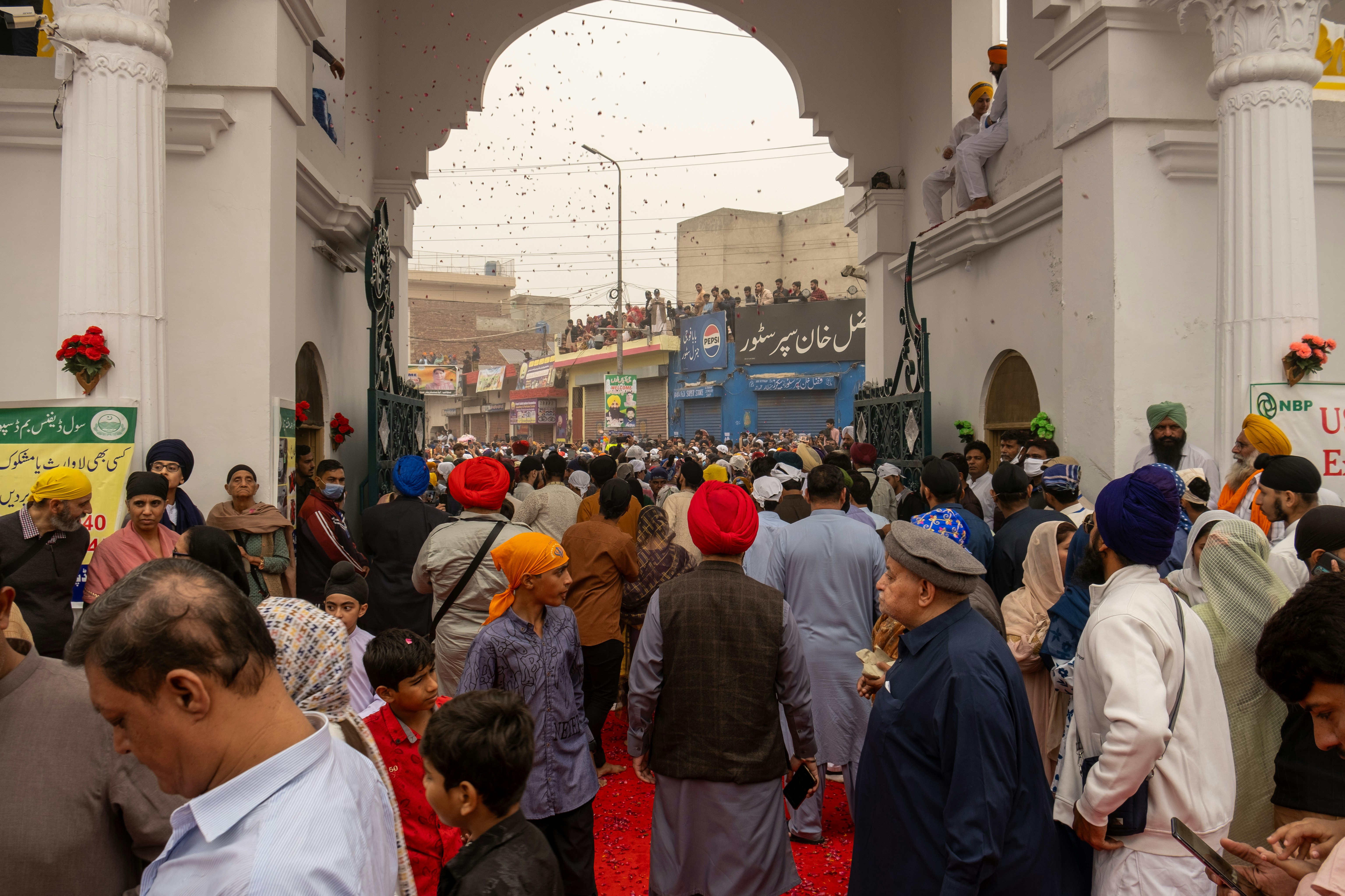 A large group of people standing in a building