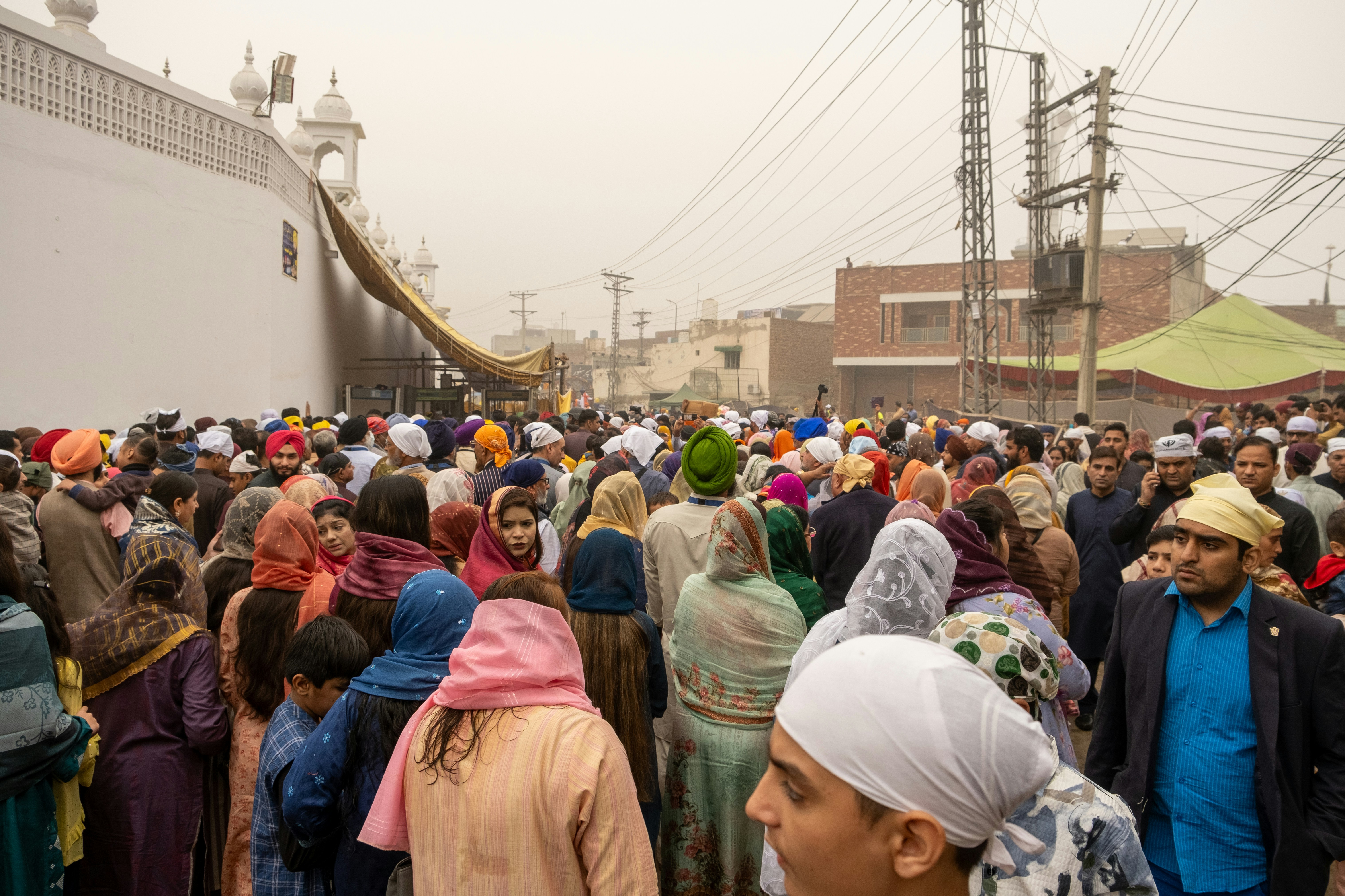 A large group of people standing in front of a building