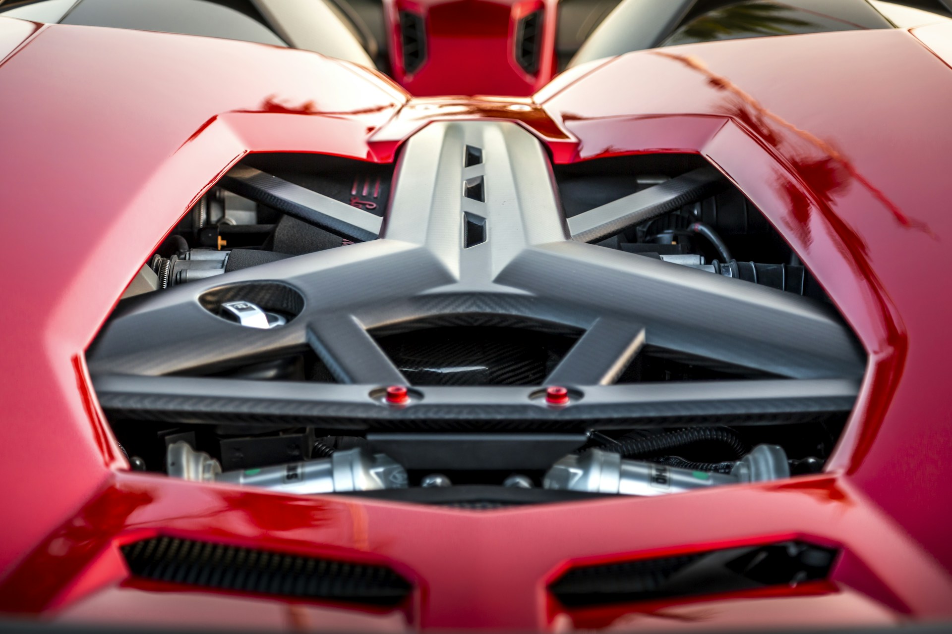 A close up of a red sports car engine