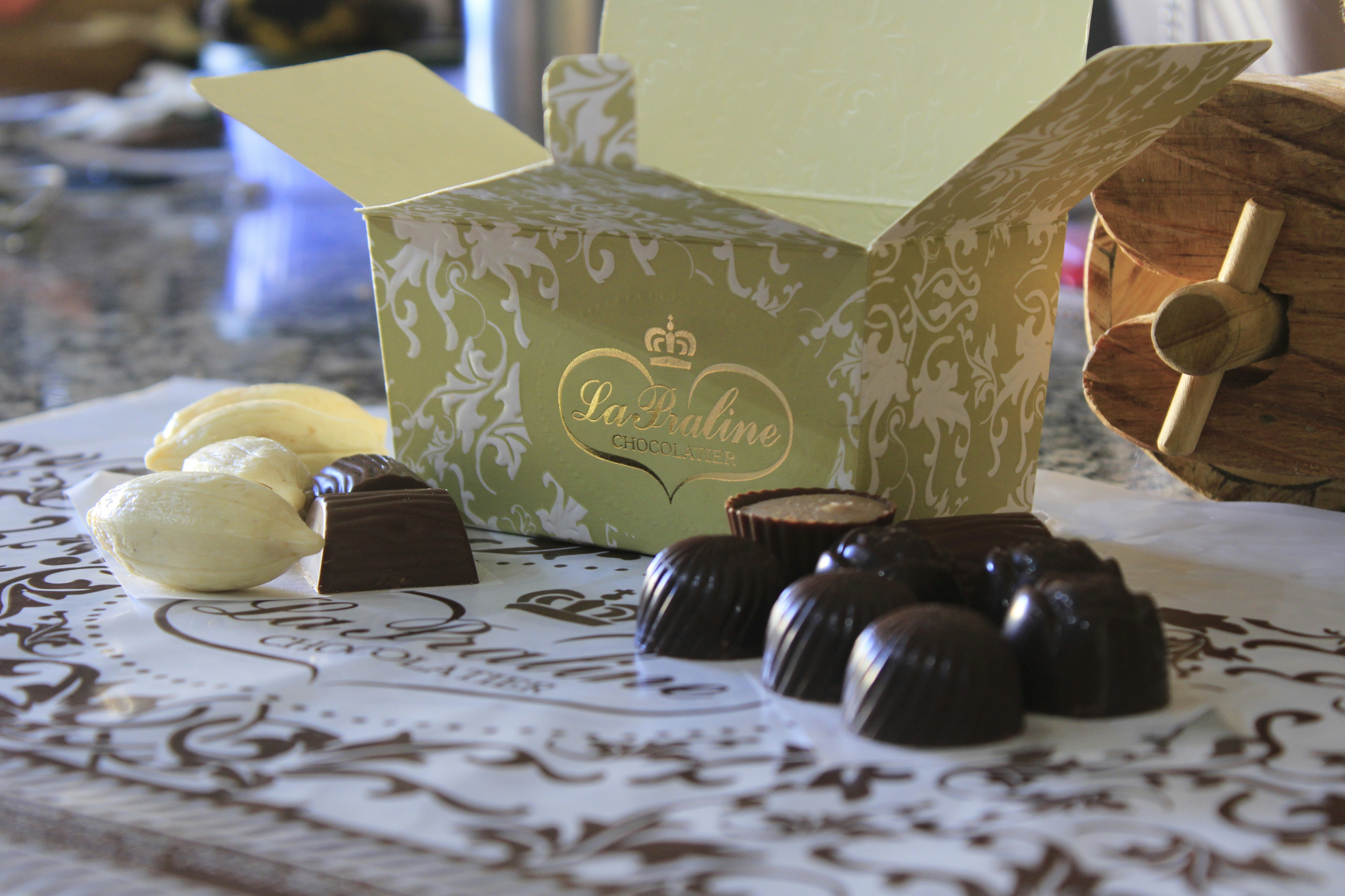 A table topped with lots of chocolates on top of a table