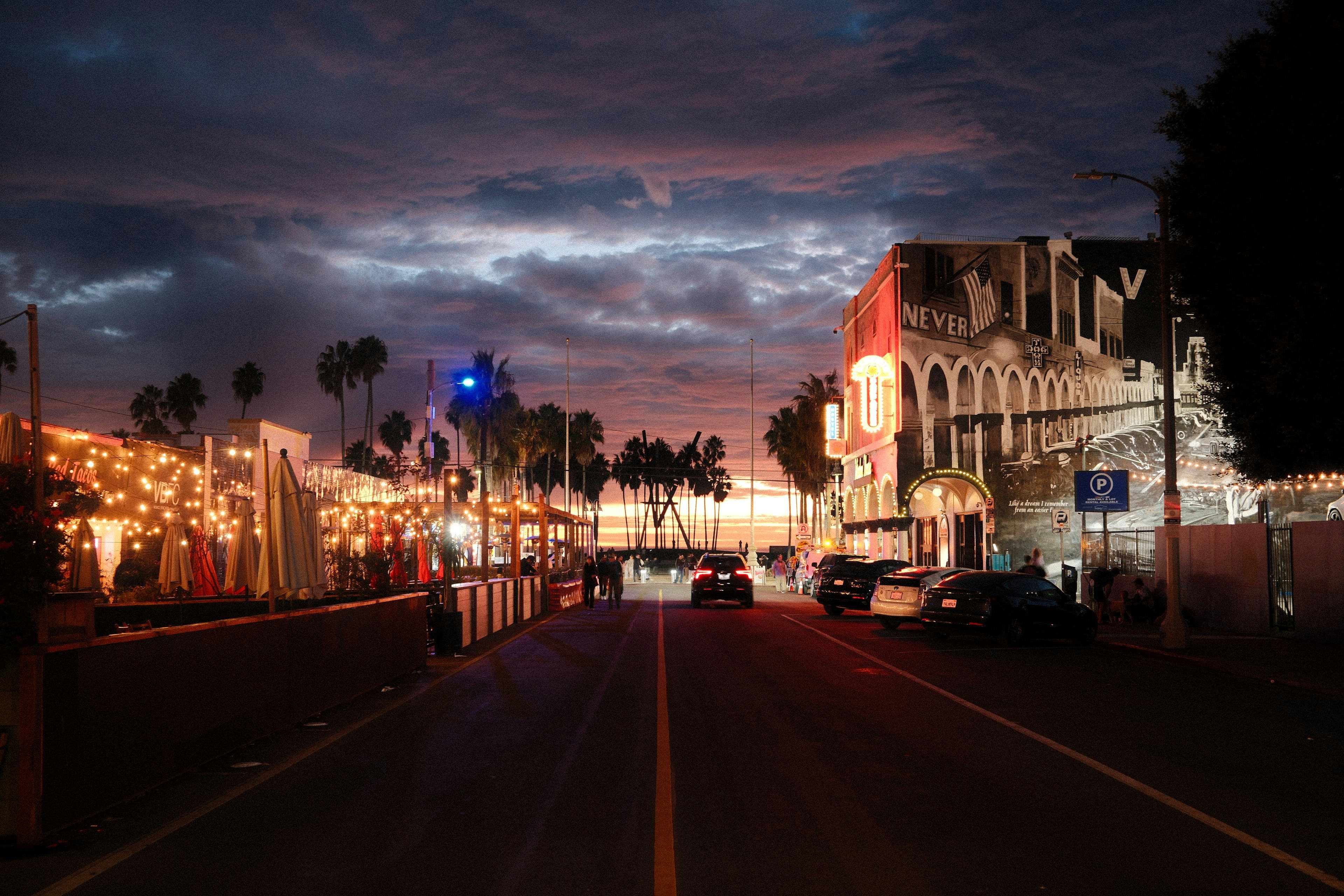 A city street at night with a traffic light