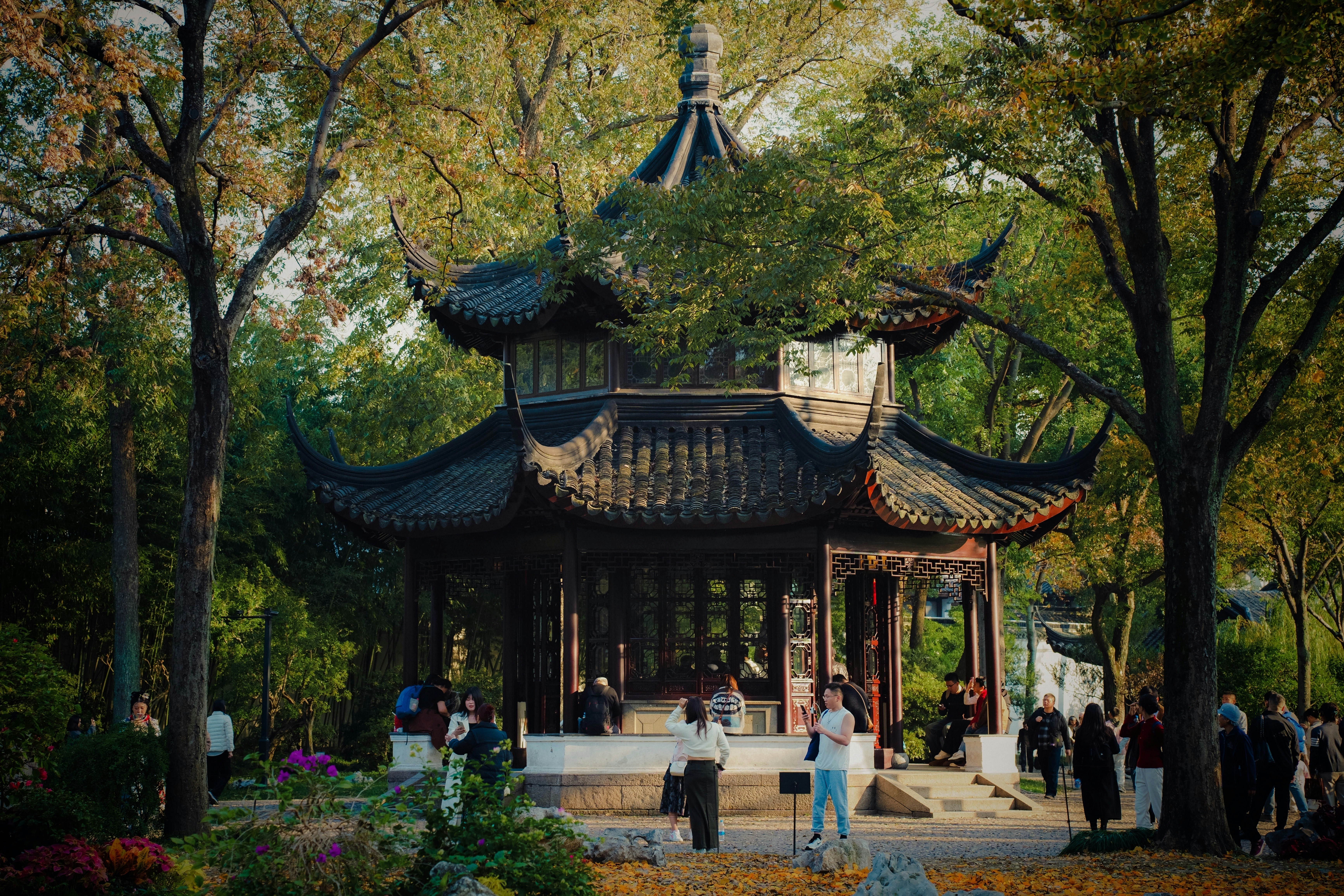 A painting of a pagoda in a park