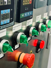 A row of gas pumps sitting next to each other