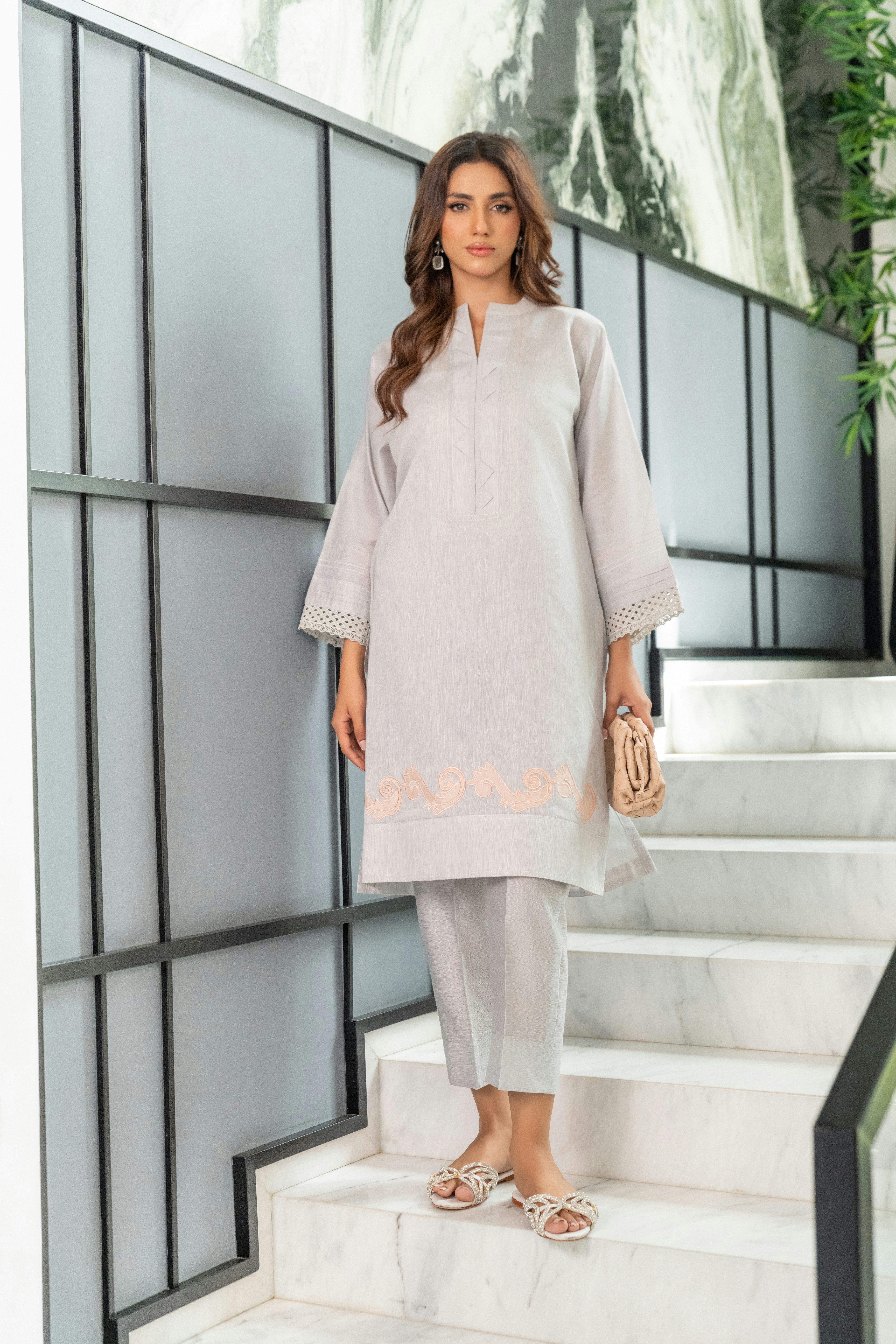 A woman standing on a set of stairs