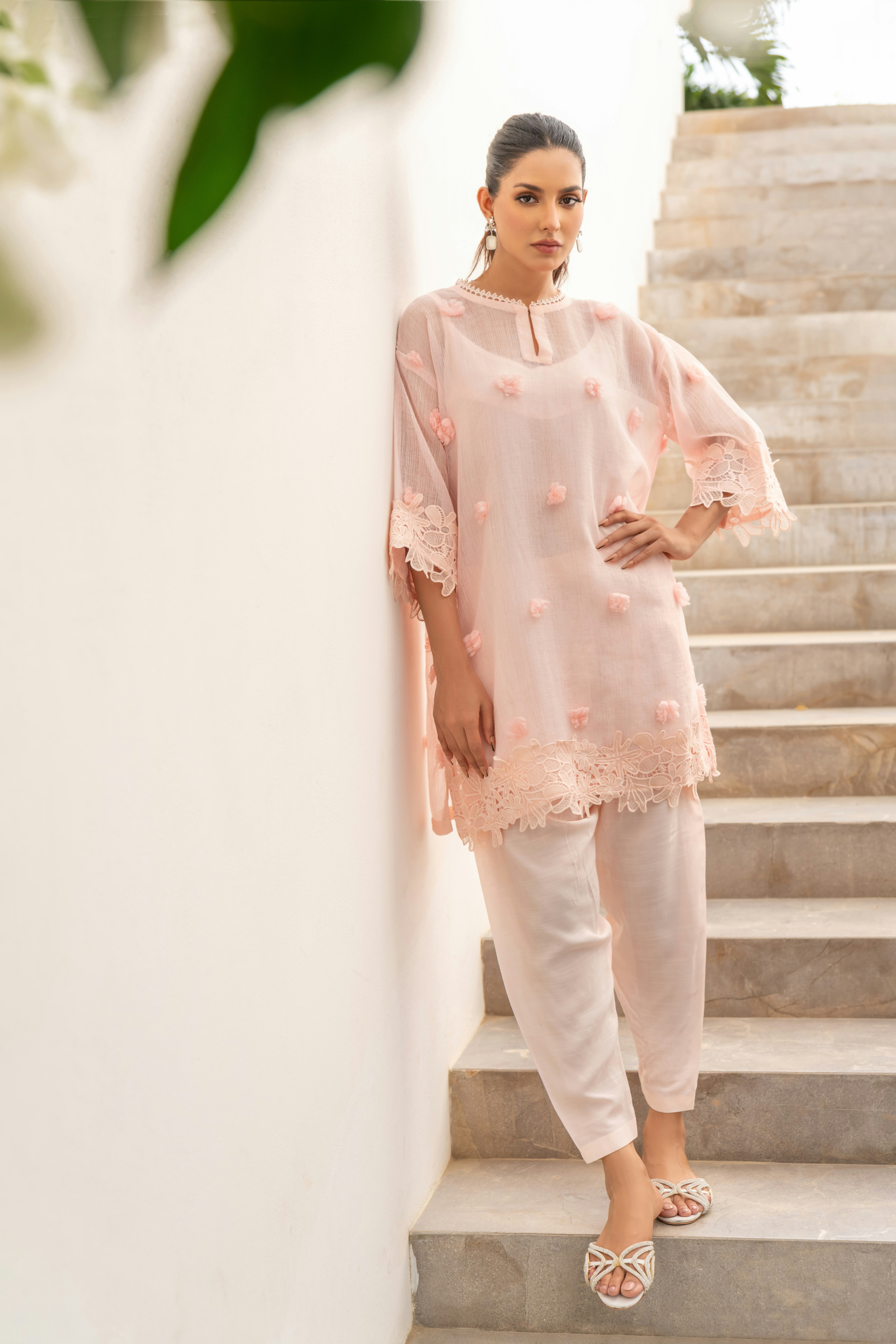 A woman standing on a set of stairs