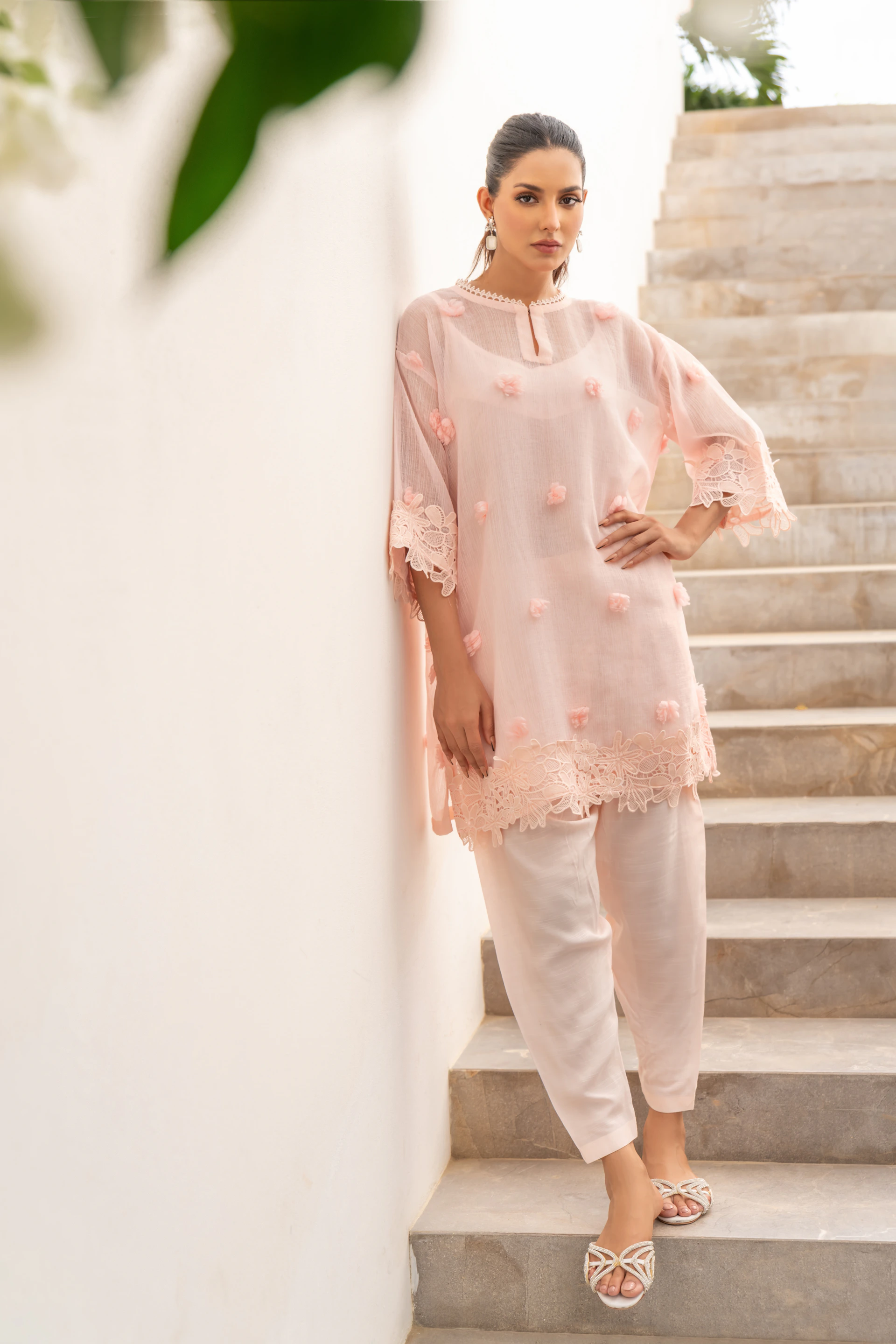 A woman standing on a set of stairs
