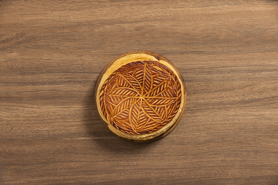 A wooden table with a wooden bowl on top of it