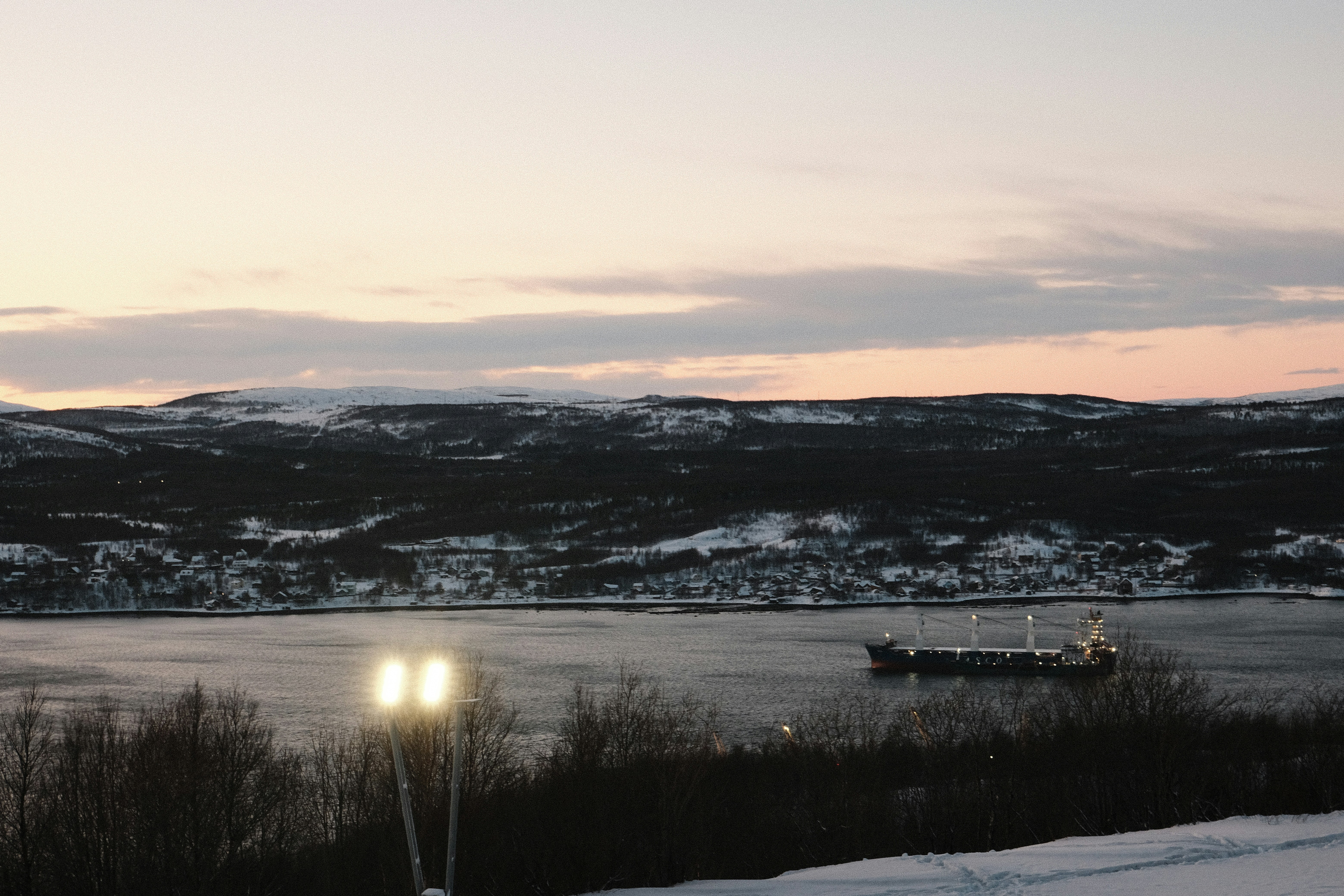 A person standing on a snow covered slope