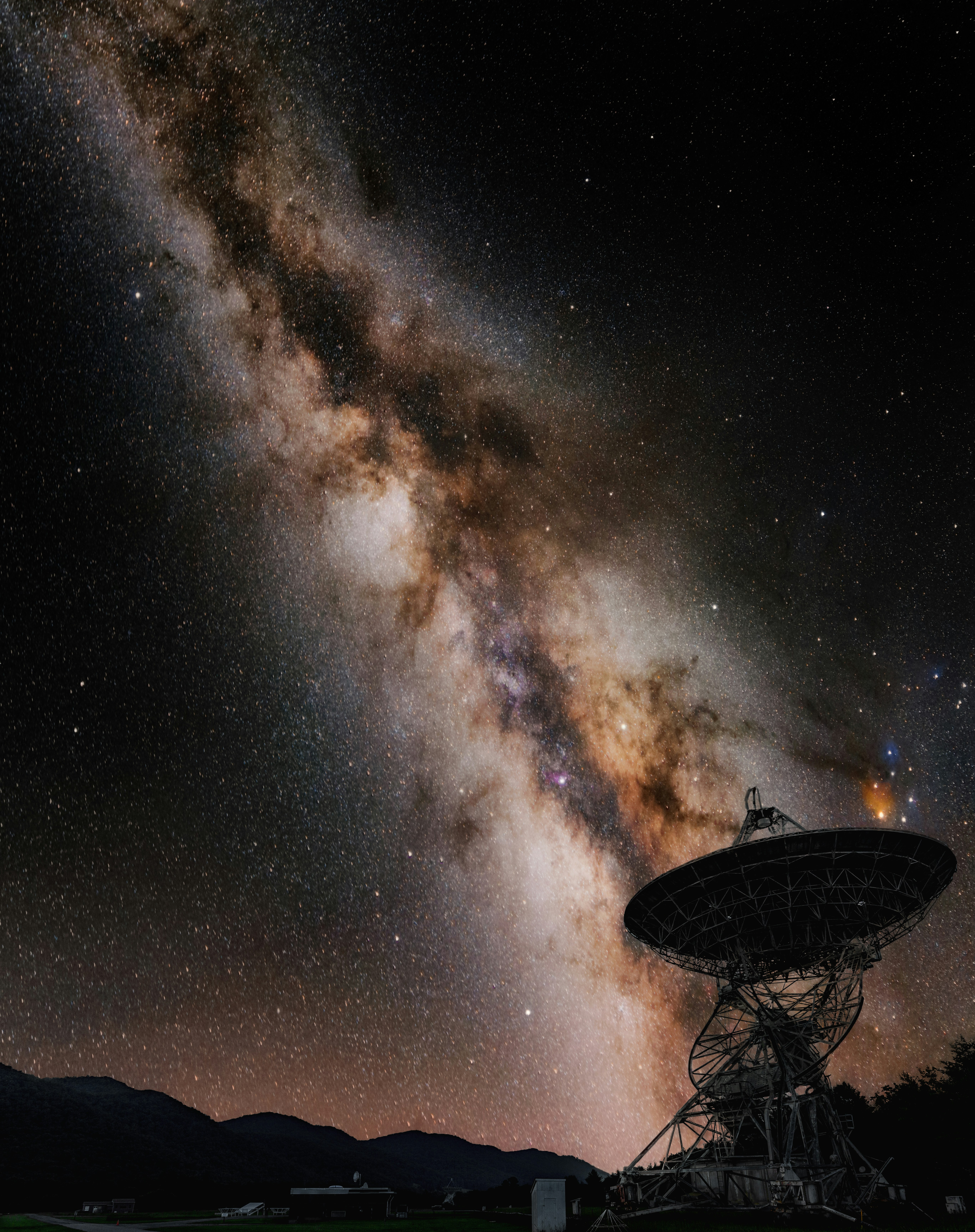 A satellite dish with the milky in the background