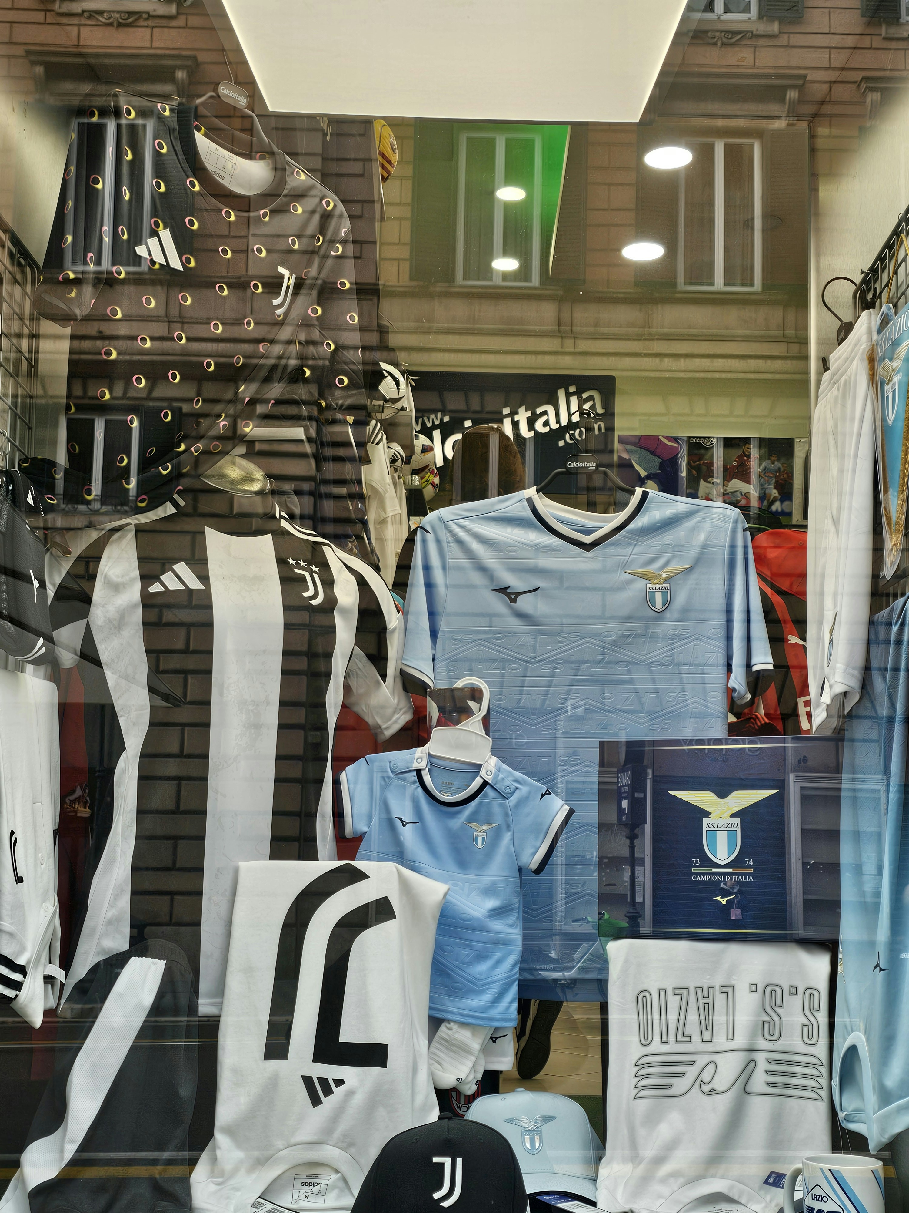 Football jersey purple color hanging on display in bright sports store