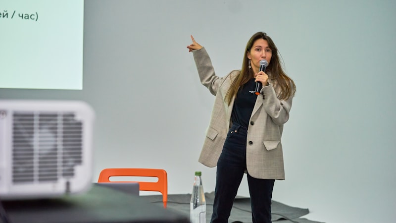 Person delivering a presentation with a screen