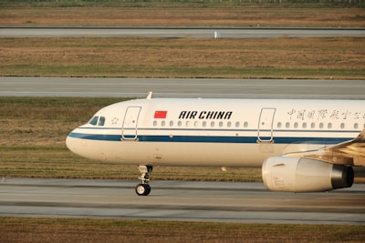 A large jetliner sitting on top of an airport runway
