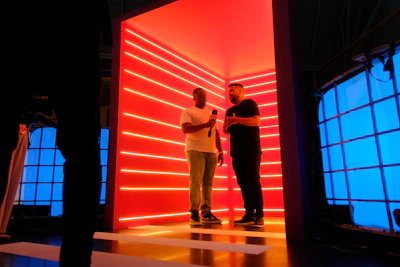 A couple of people standing in a room