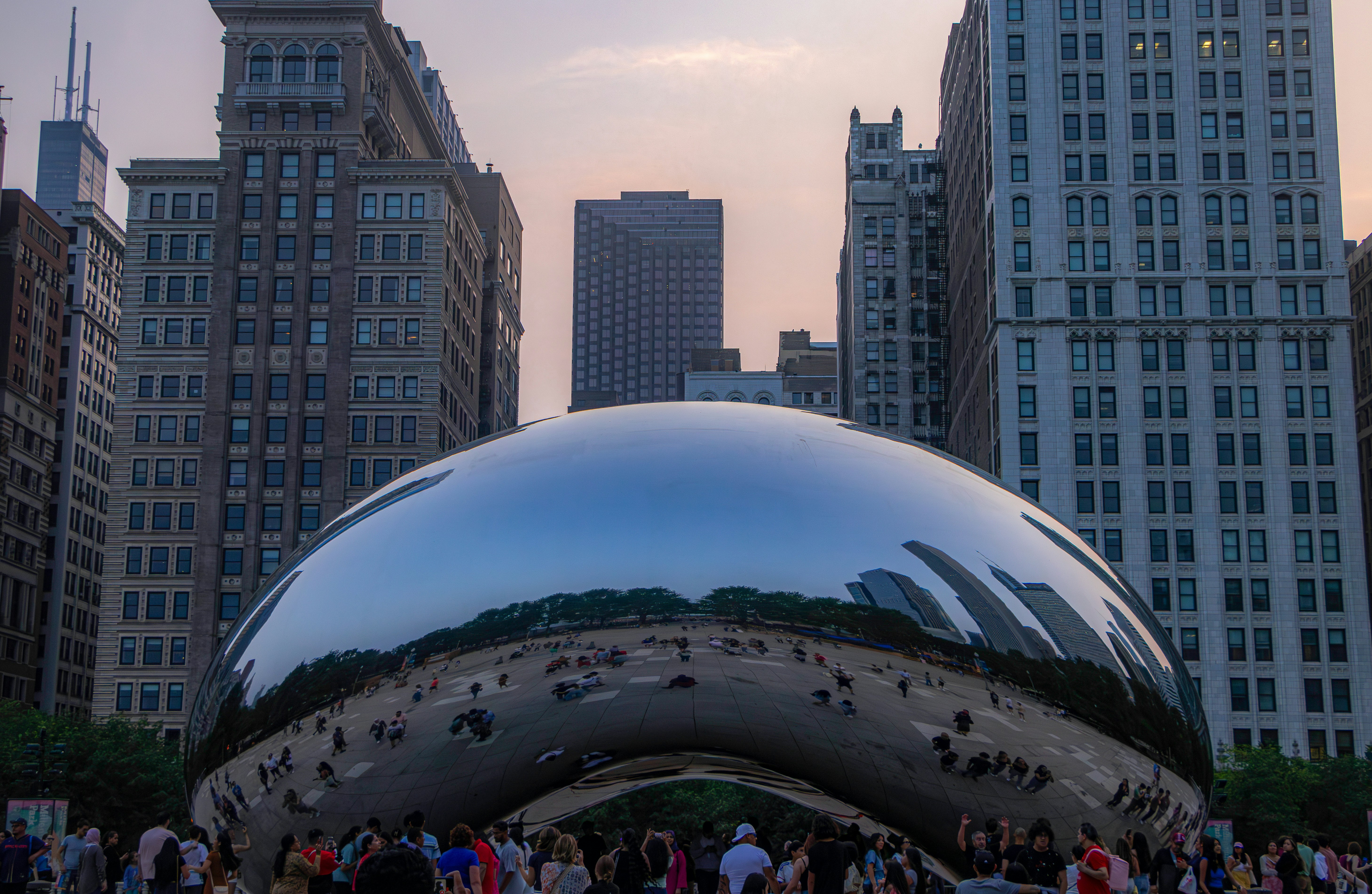 A group of people standing around a large metal object