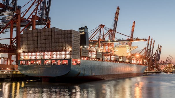 A large ship is docked at a dock