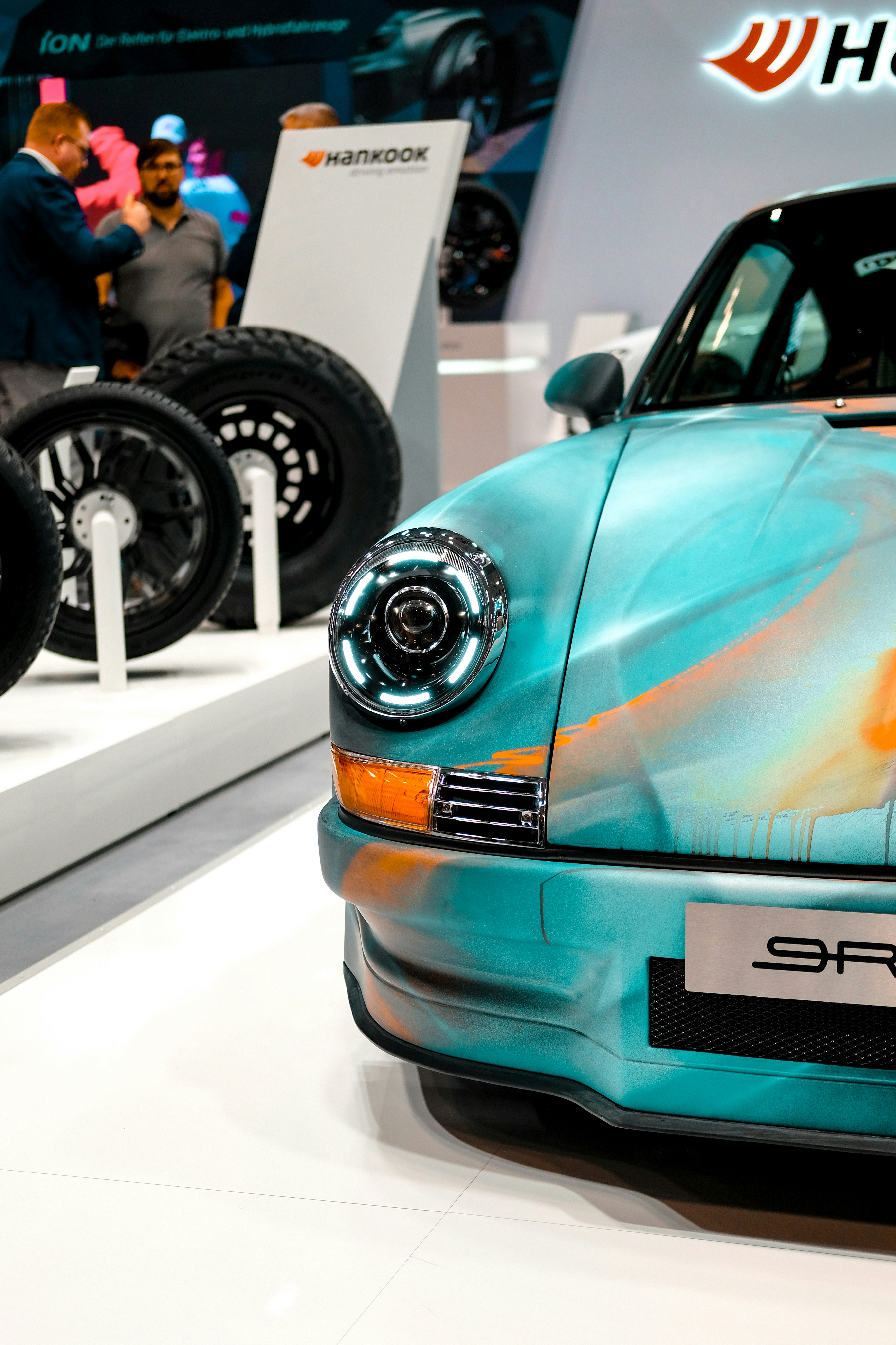 A close up of a car on display at a car show