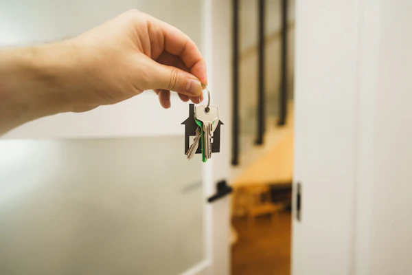 Hand holding a set of house keys