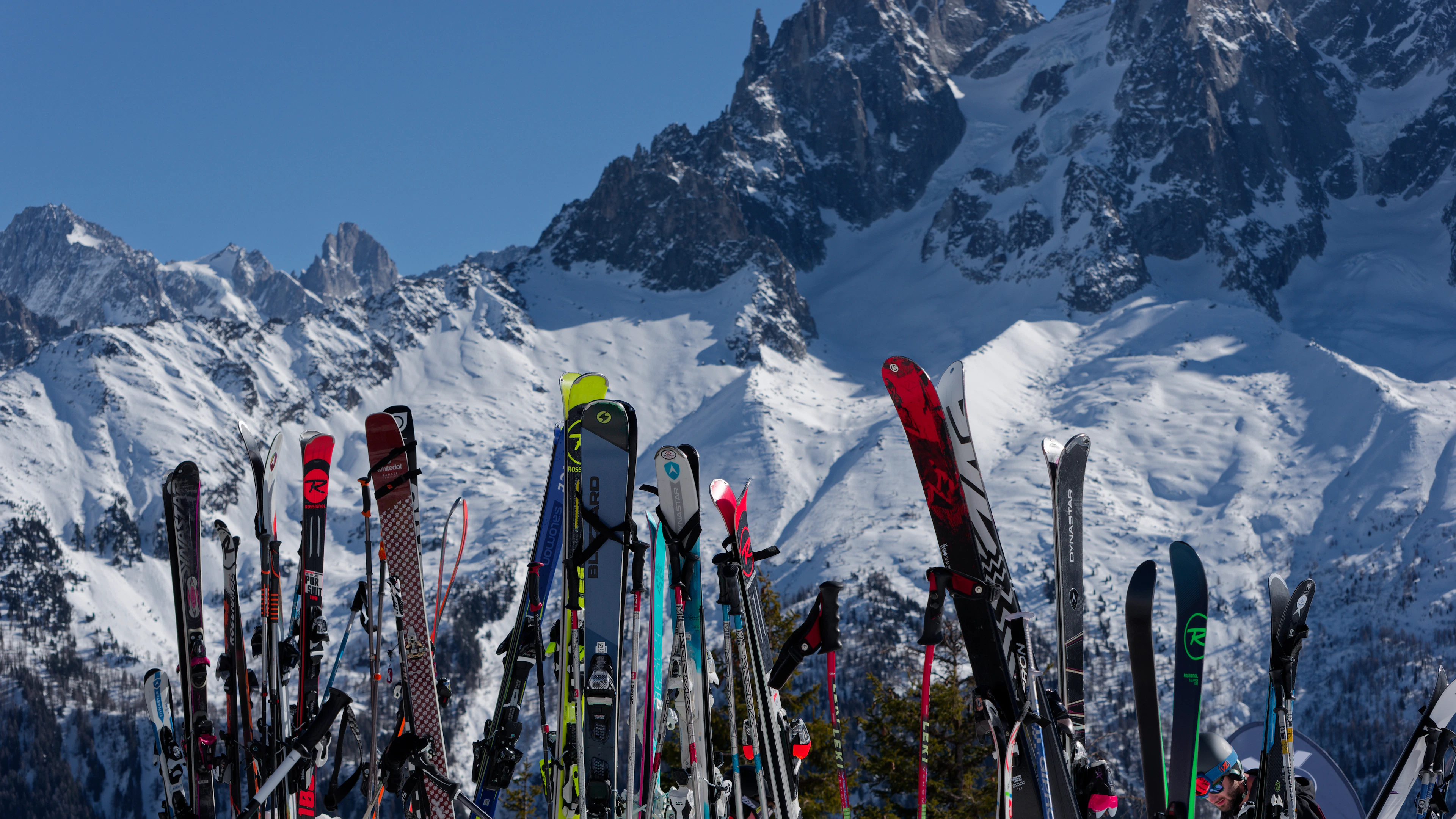 Skis standing in the snow below the Mont Blanc massif, on Chamonix ski holidays in France