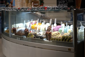 A display case filled with lots of different types of food