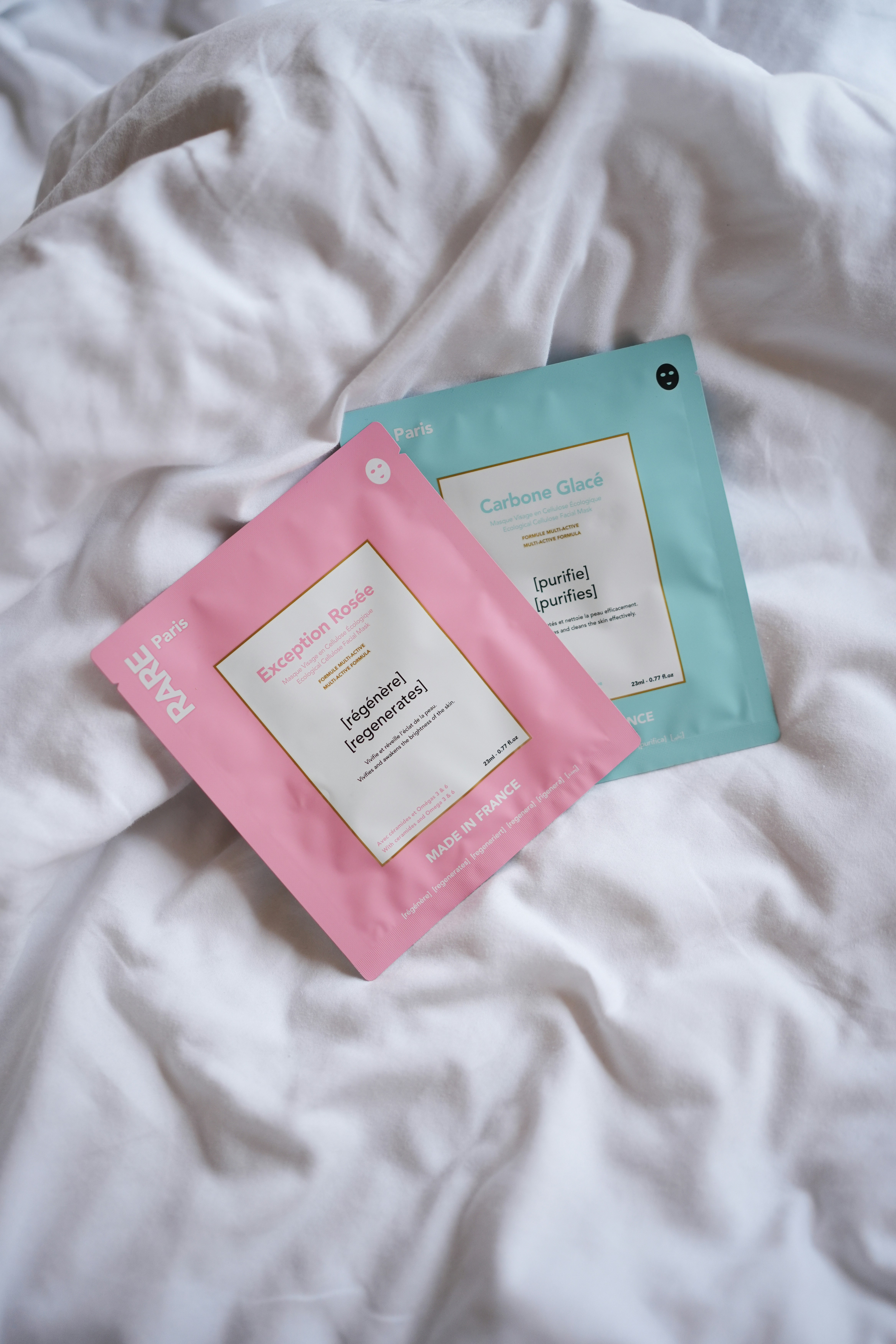 A couple of packets sitting on top of a bed