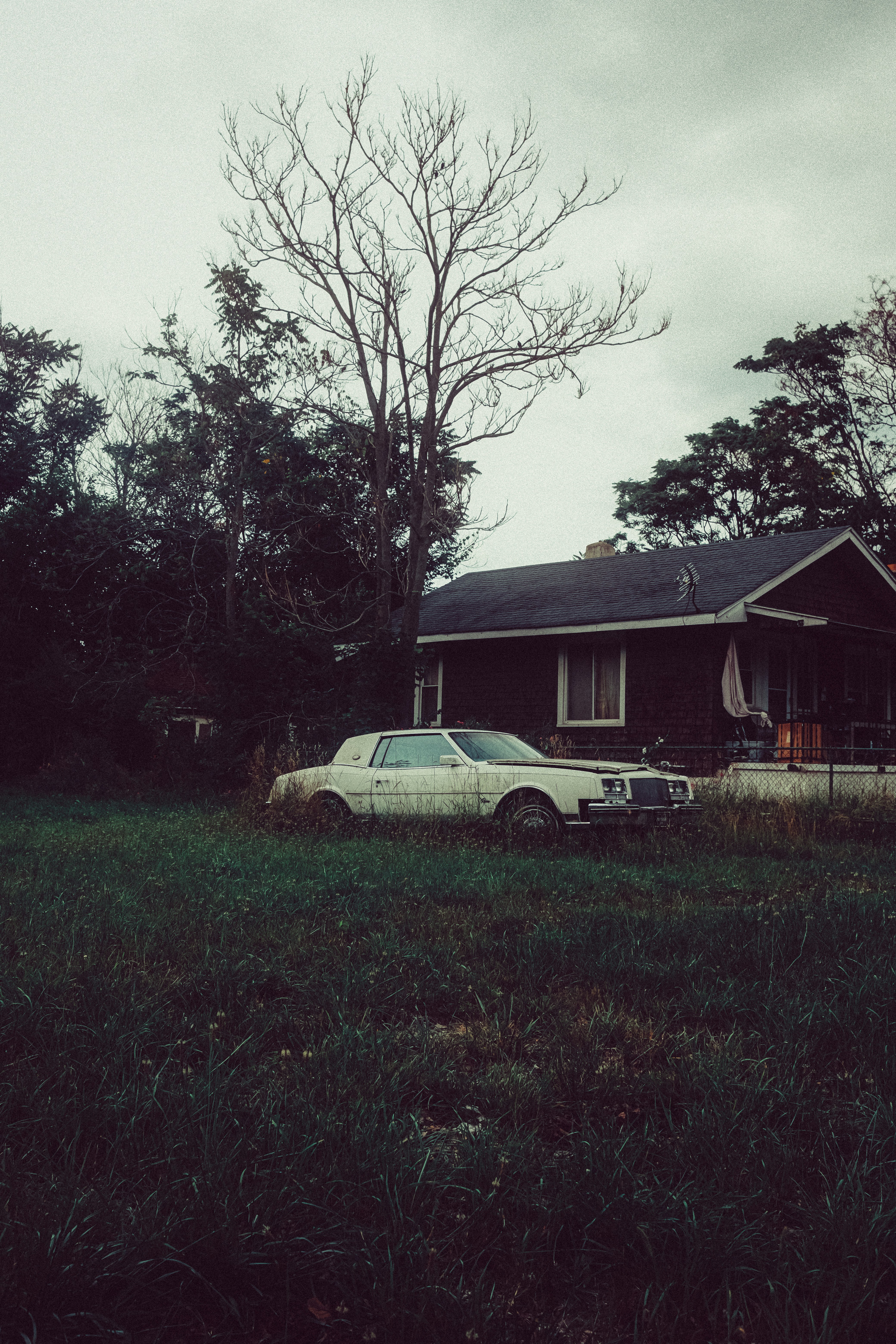 A car is parked in front of a house