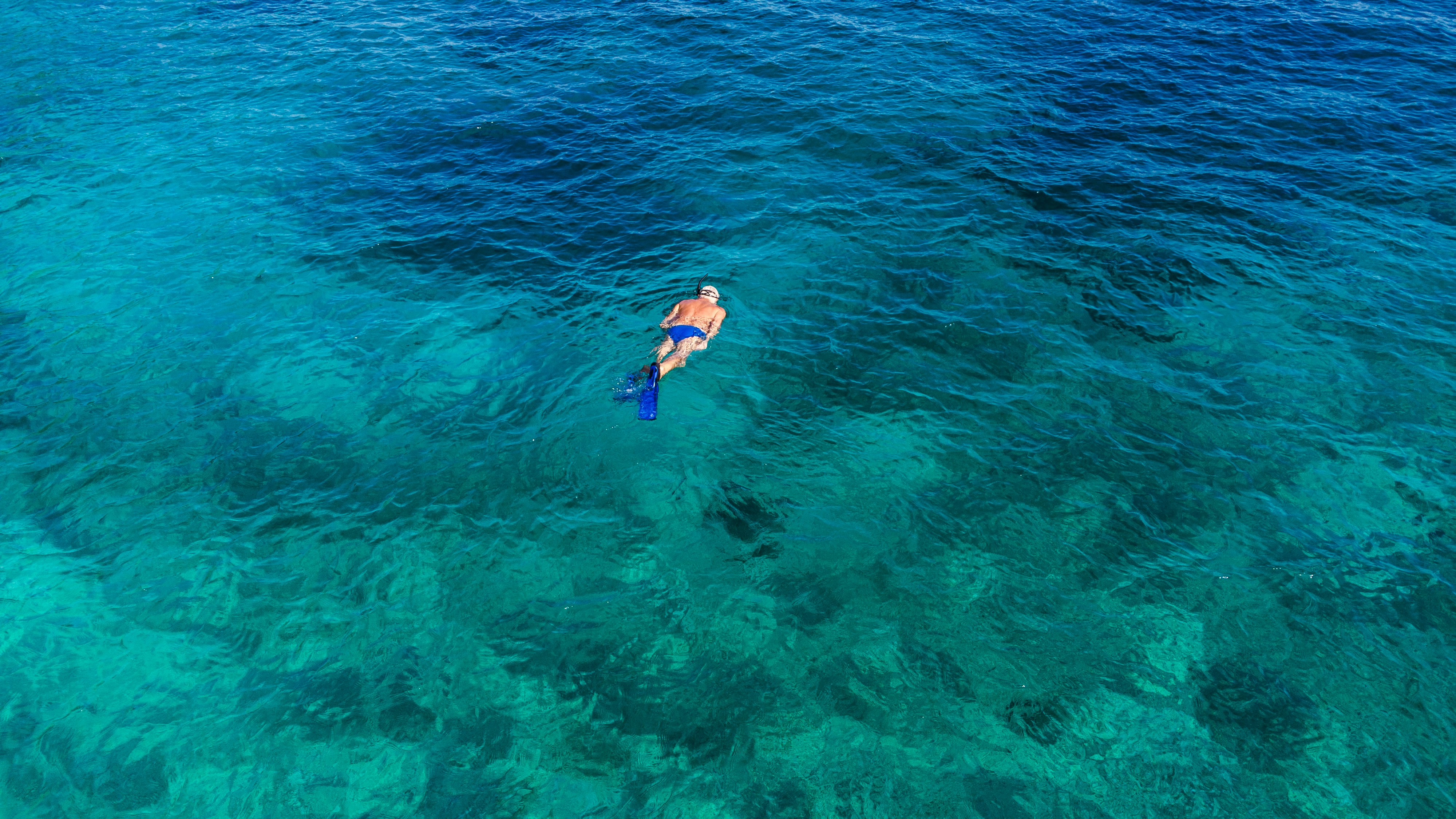 A person in a kayak in the ocean