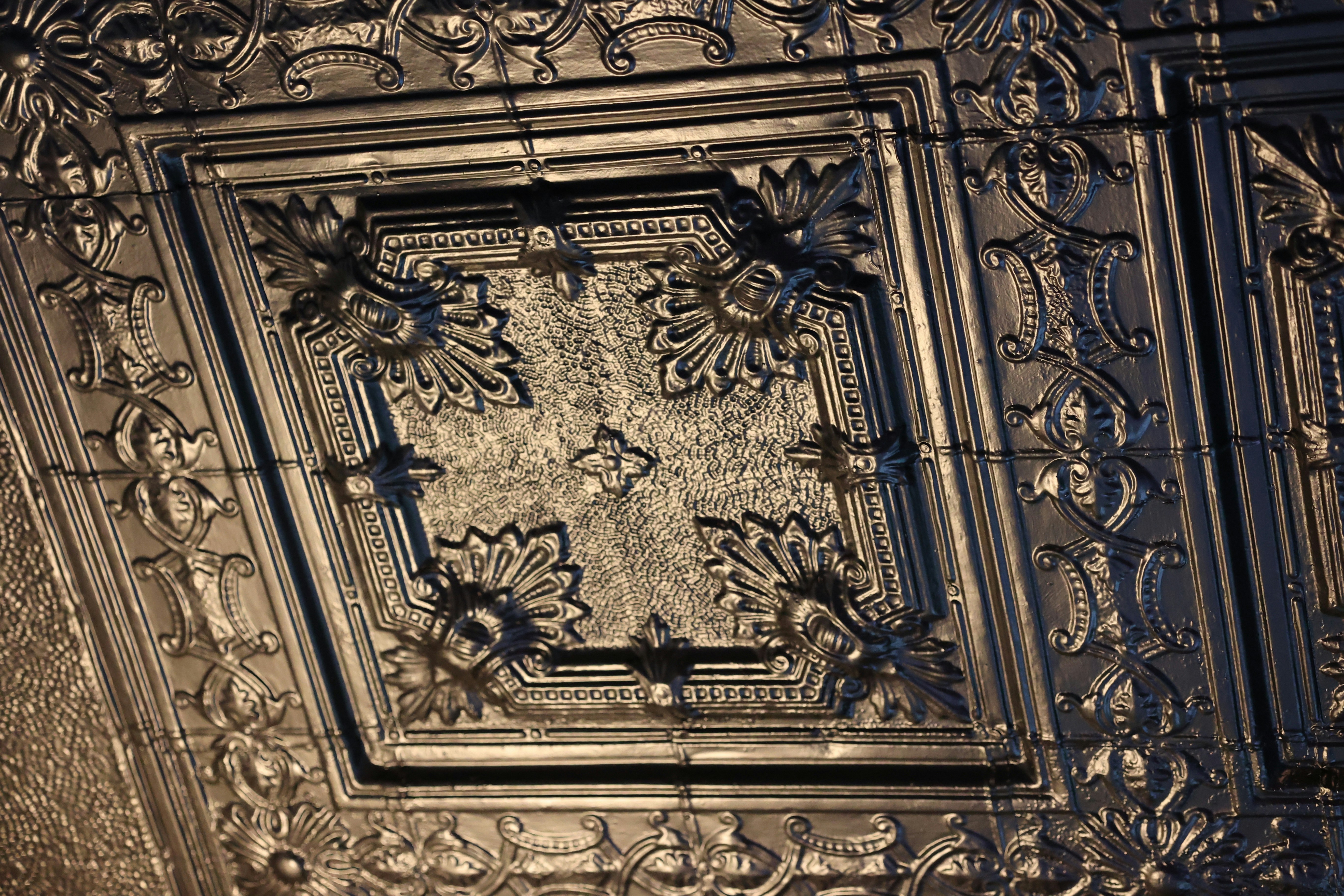 The ceiling of a building with a decorative design
