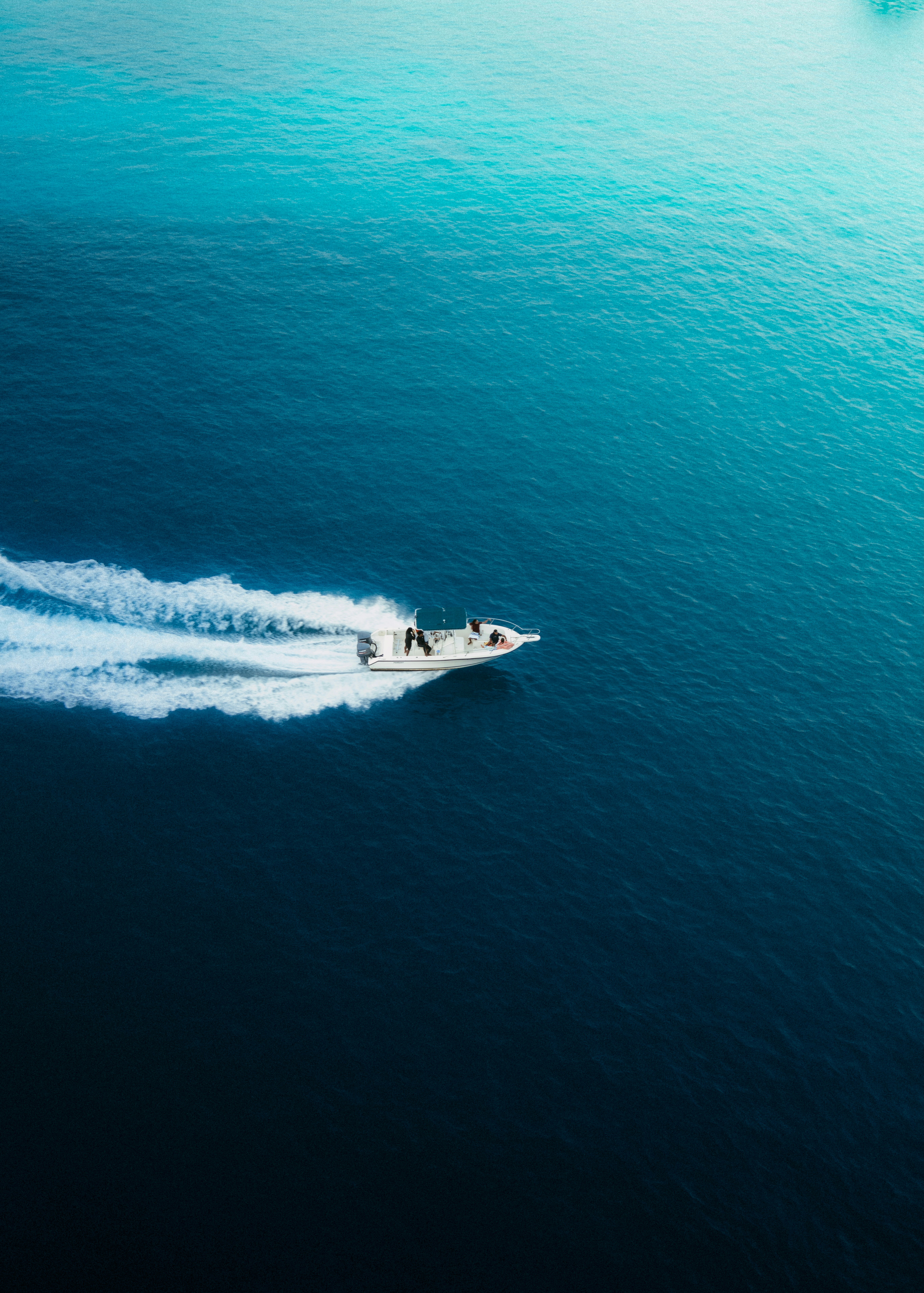 A boat is traveling across the water