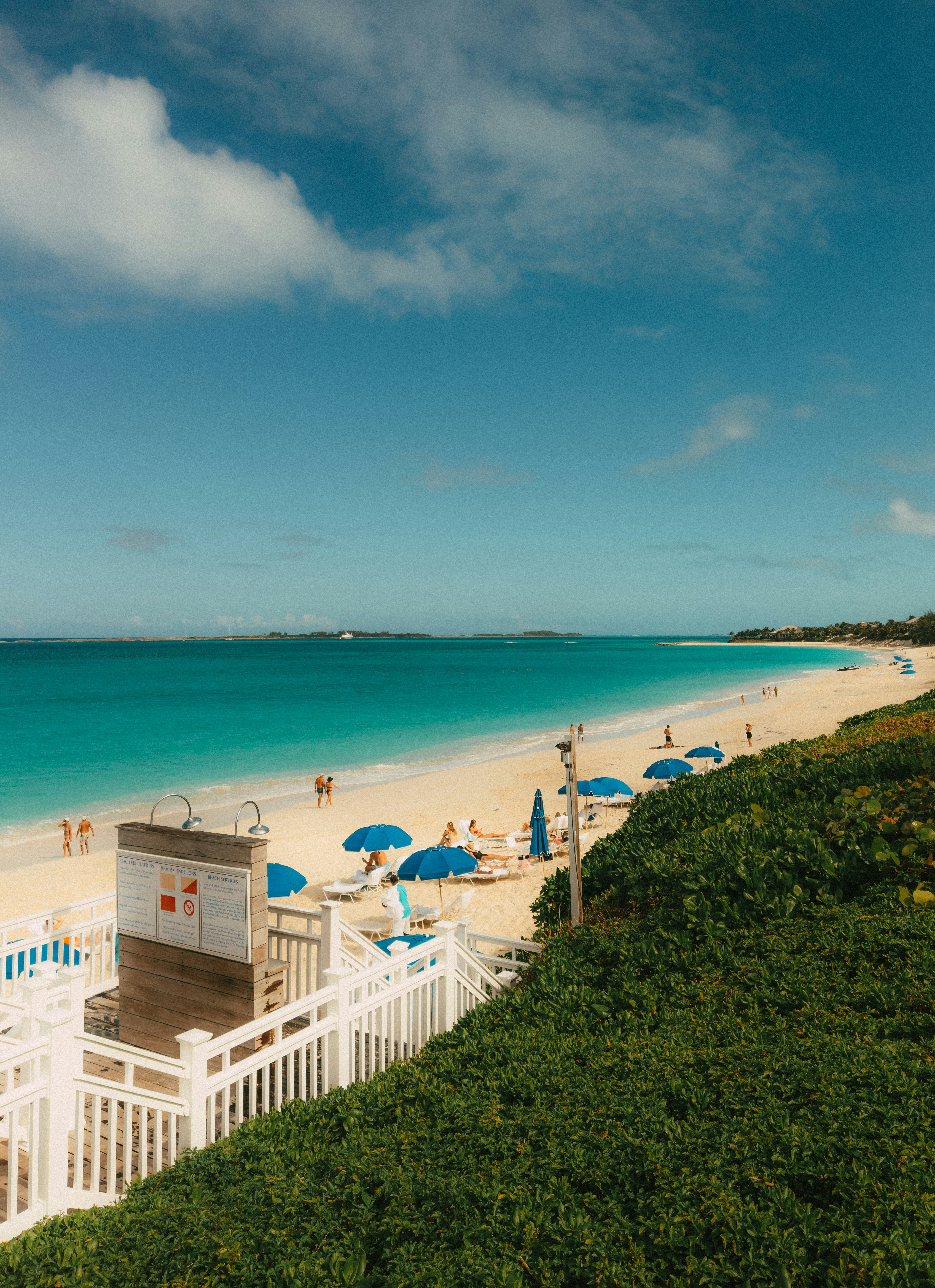 A beach that has a bunch of umbrellas on it