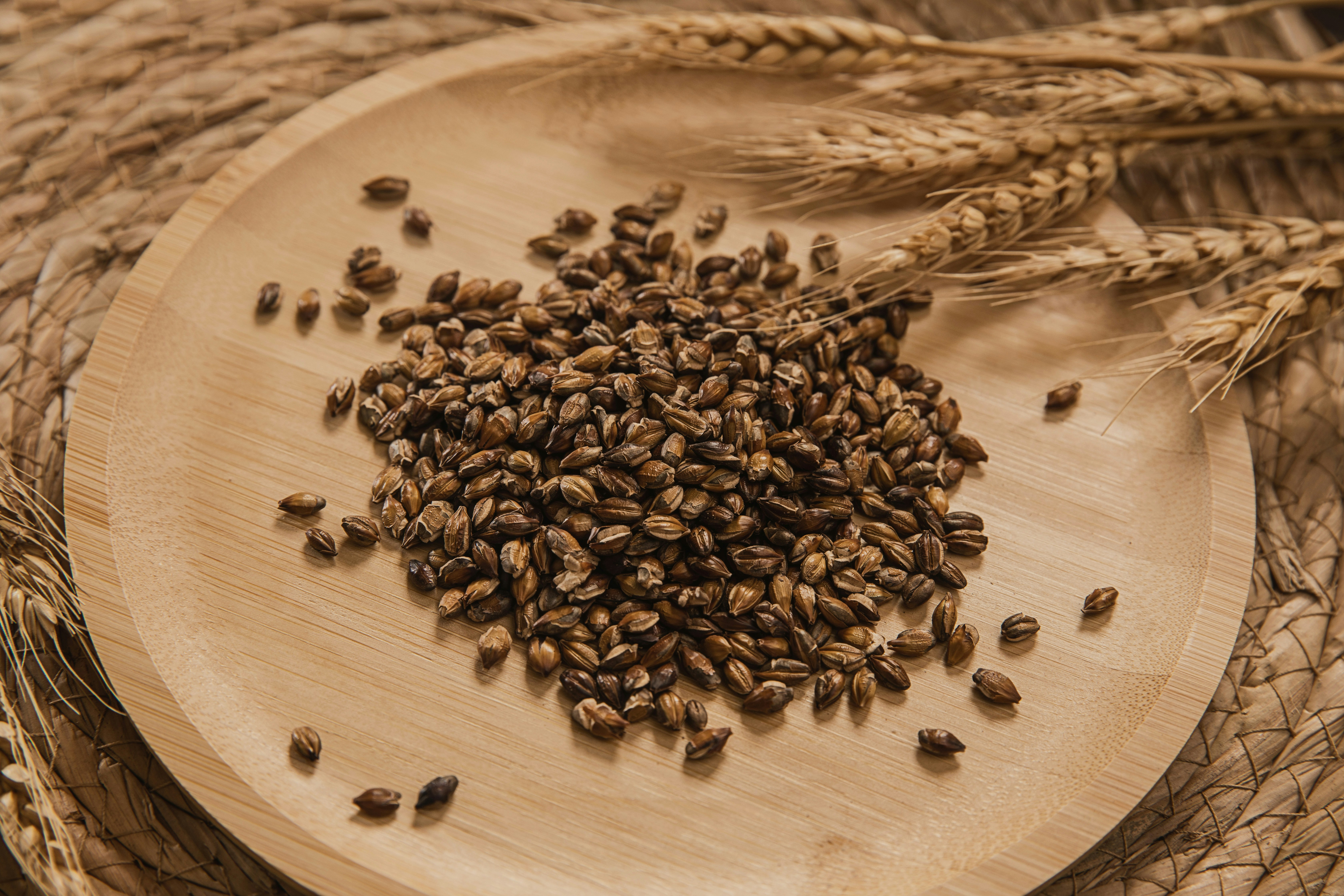 A bunch of seeds sitting on top of a wooden plate
