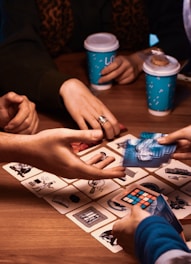 A group of people sitting around a table playing a game