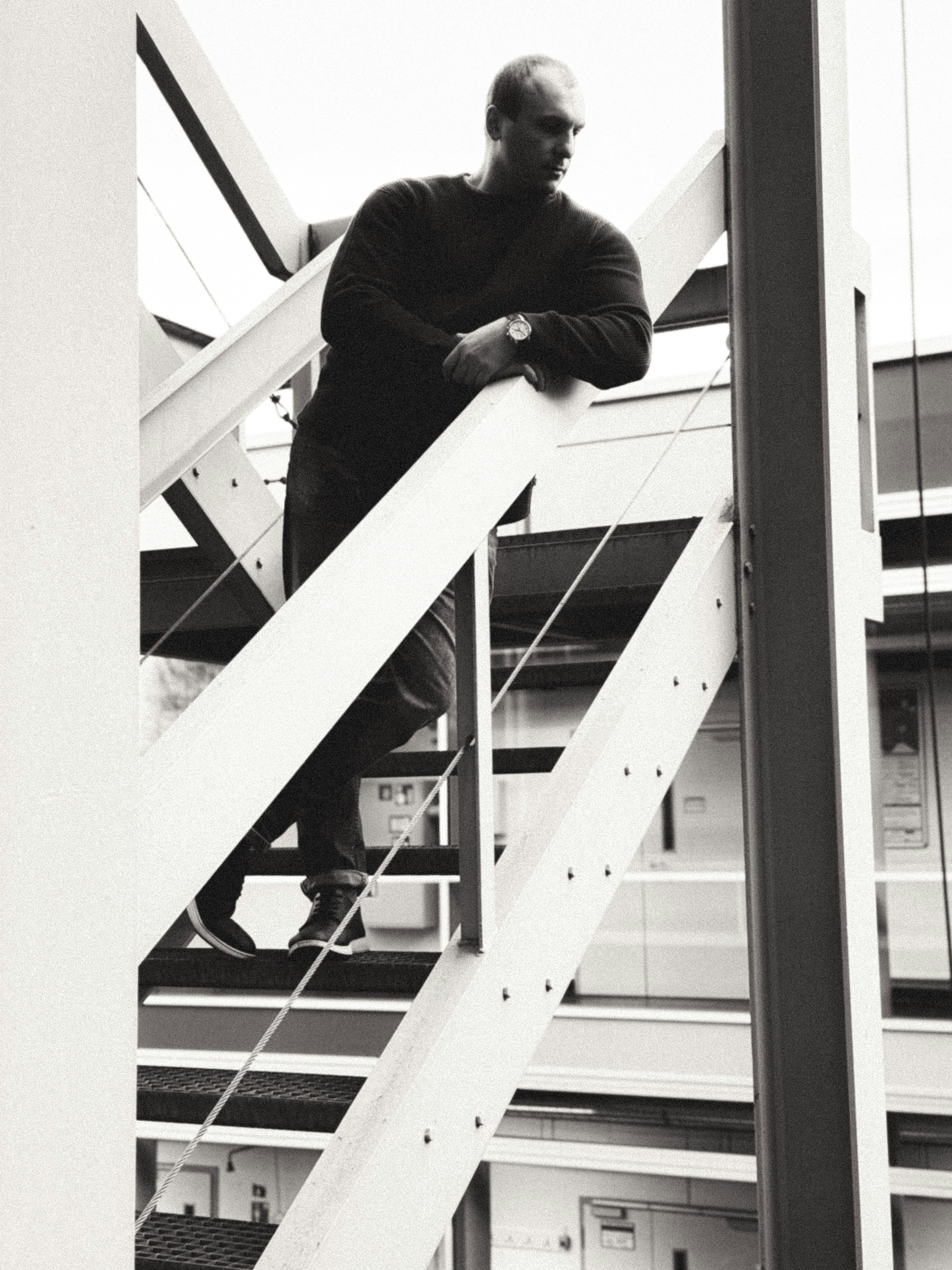 A man standing on top of a stair case