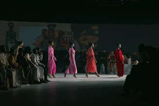 A group of women walking down a runway